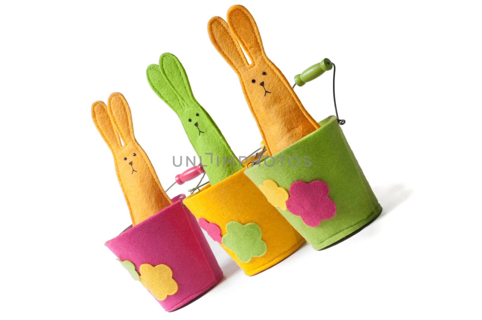 Multicolored easter bunnies sitting on the pots