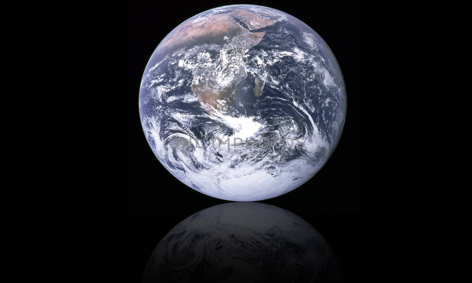 planet earth and its reflection on black