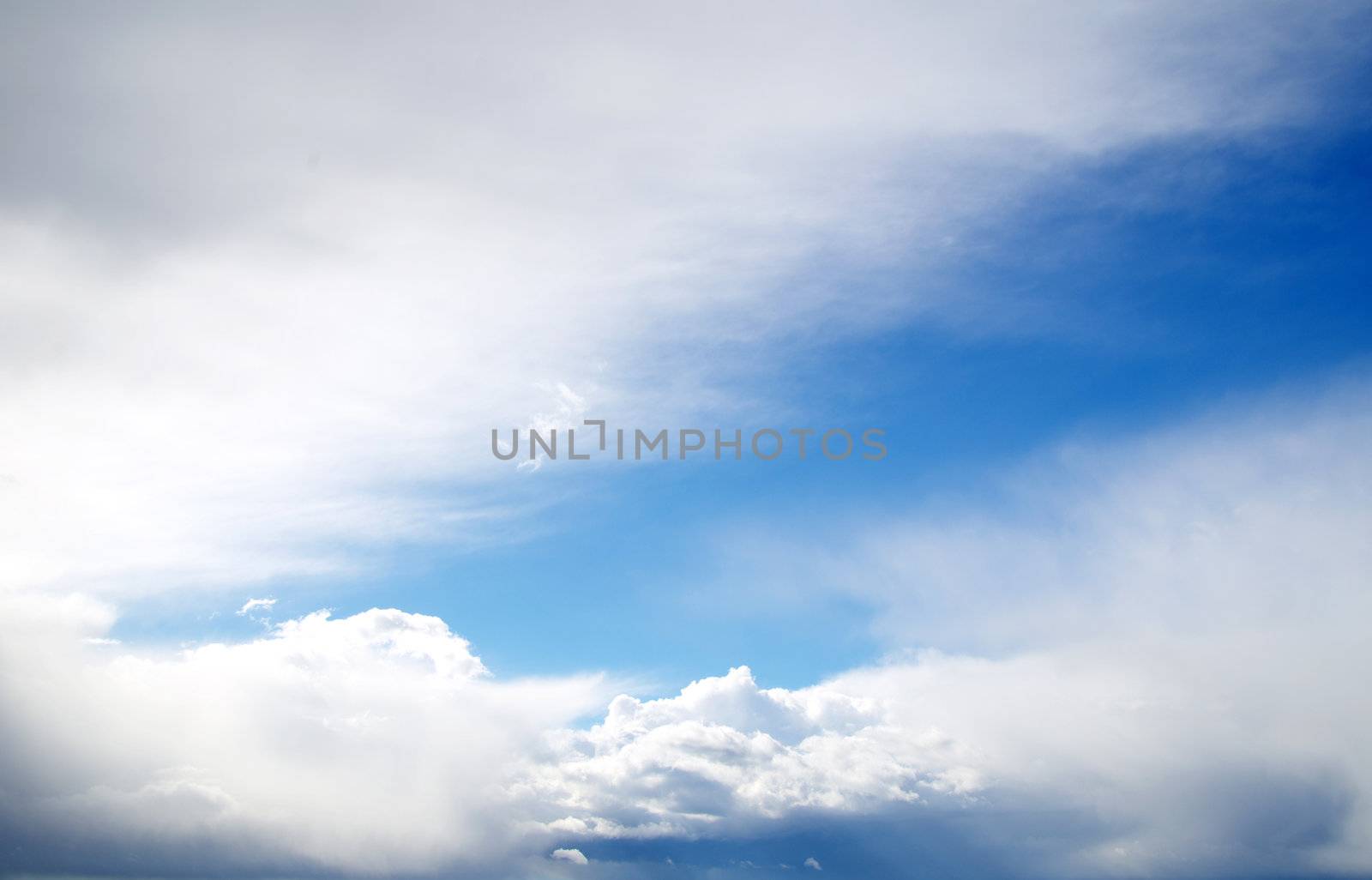 blue sky background with tiny clouds