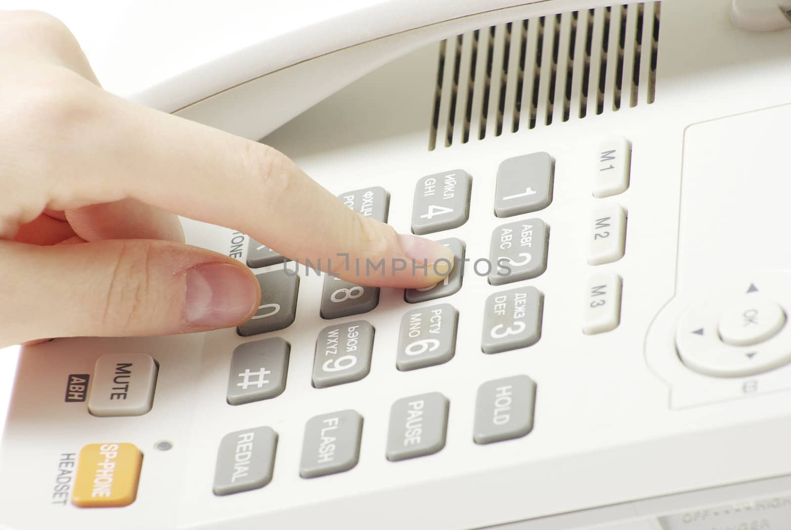 finger with  white telephone keypad