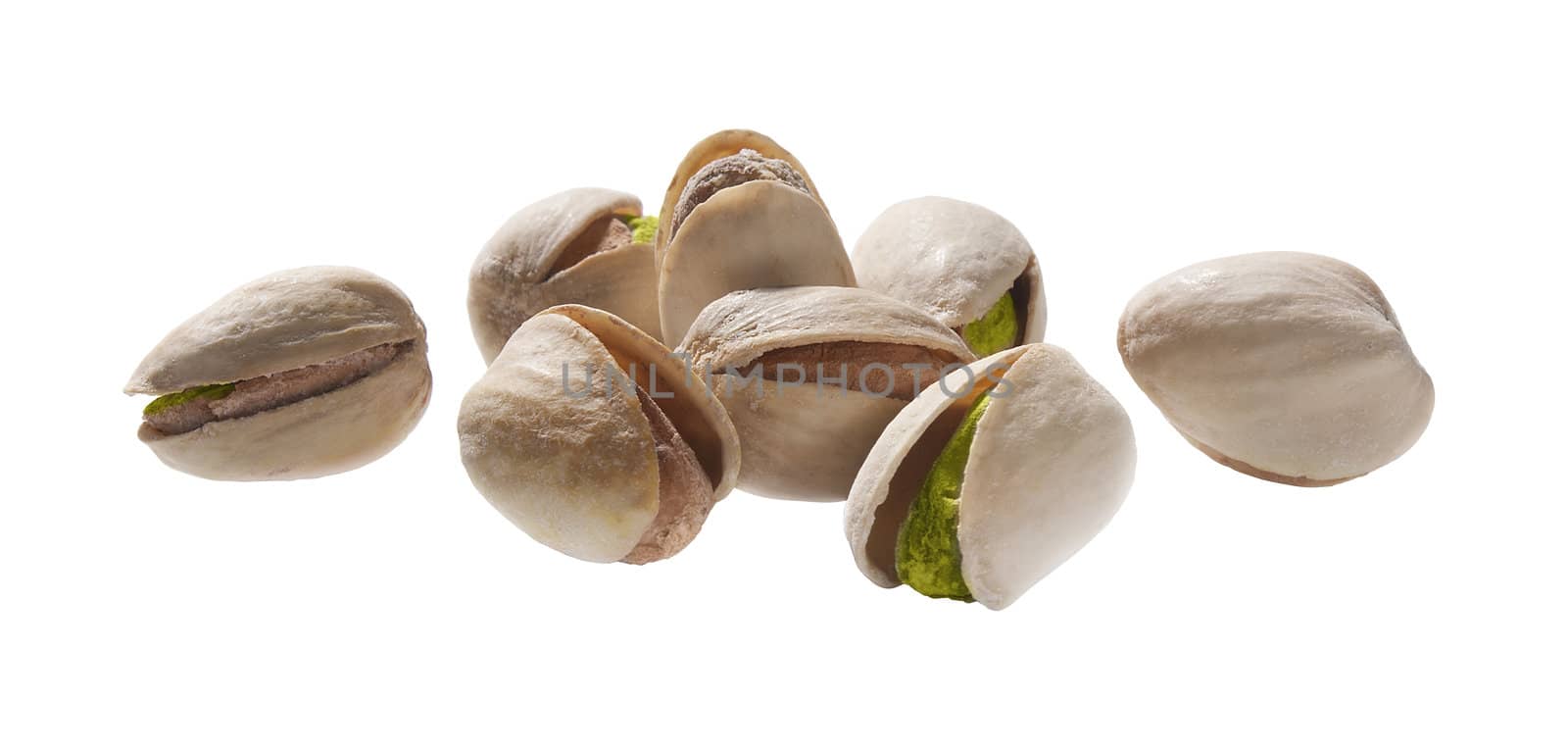 Some isolated pistachios on the white background