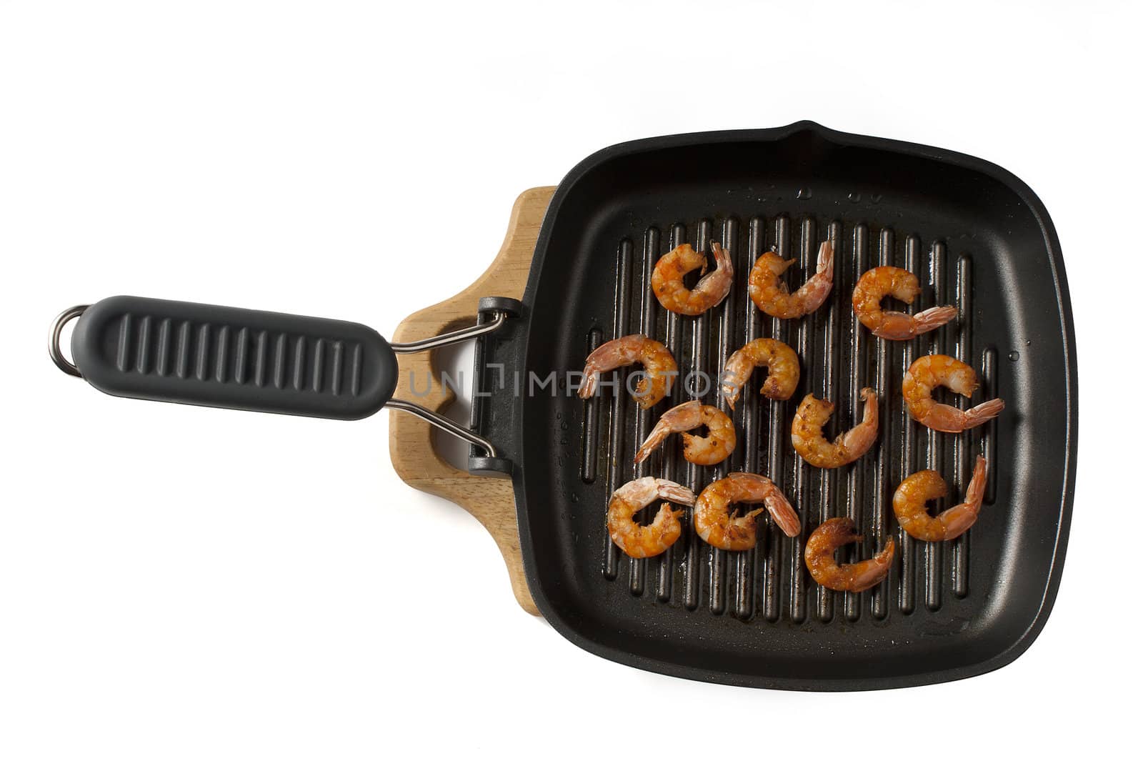 Some roasted shrimps on the grill black pan
