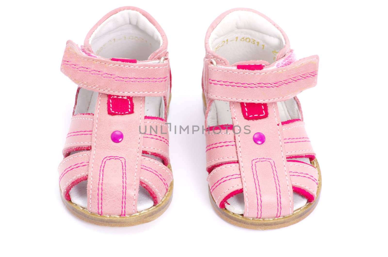 pink child's sandals isolated on white