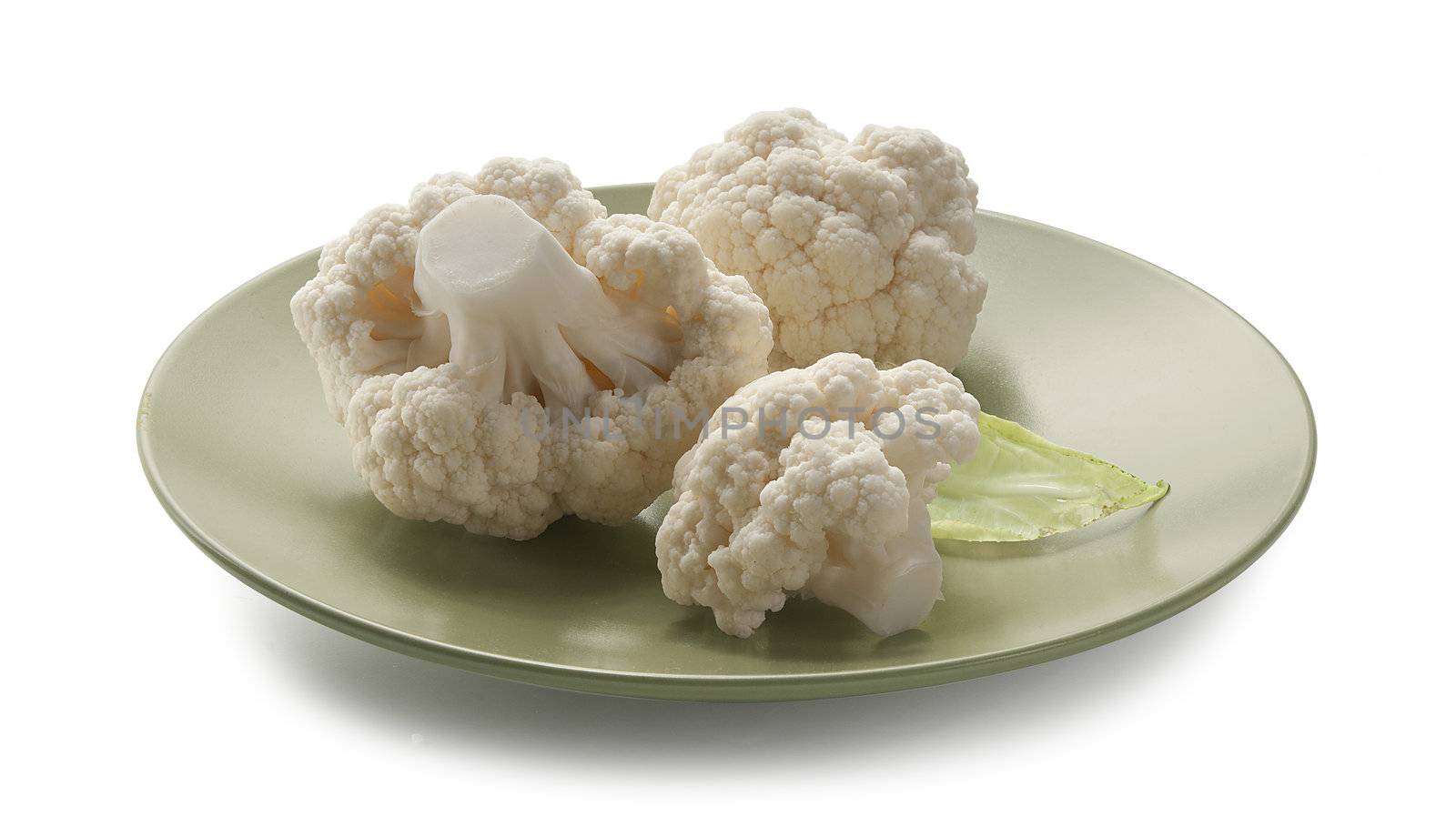 Three pieces of cauliflower on the green plate