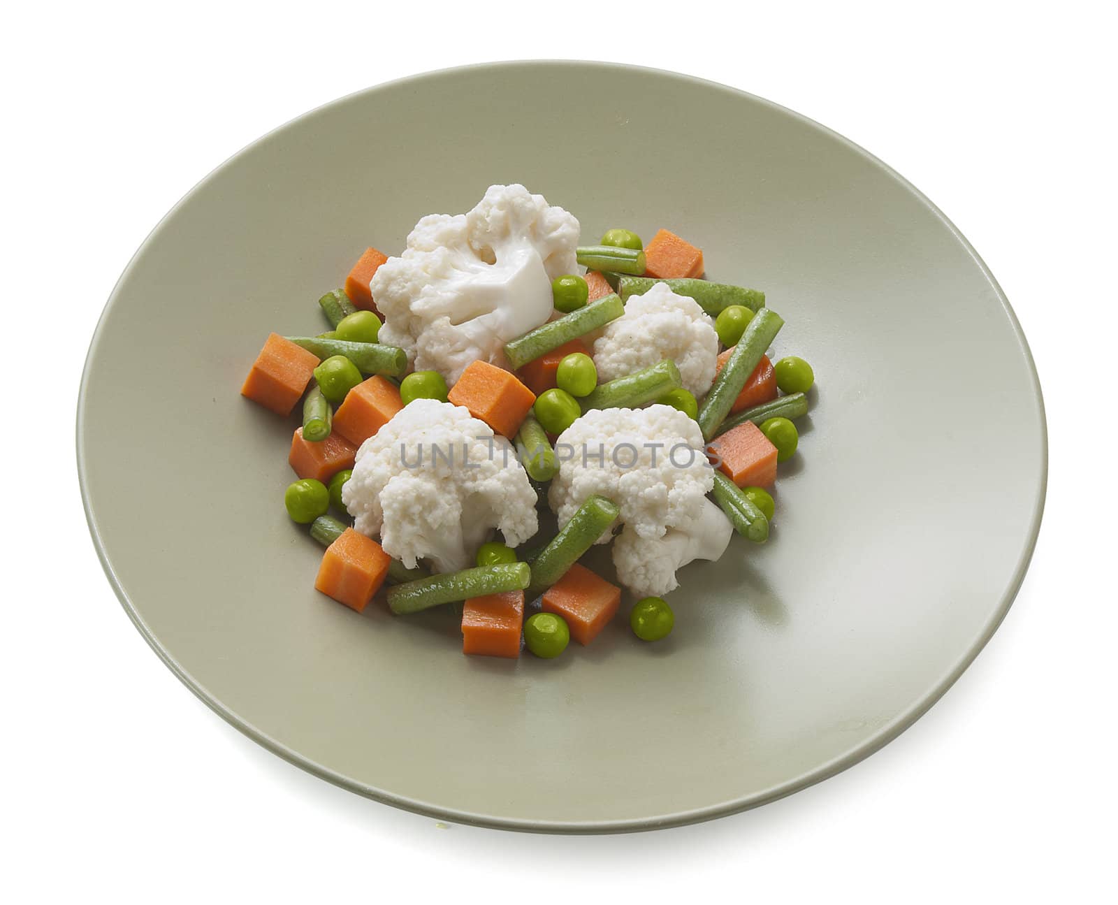 Vegetable mix with cauliflower, carrot, peas and kidney bean on the green plate