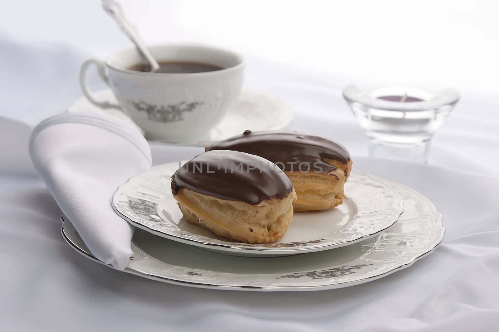 Eclairs with tea by Angorius