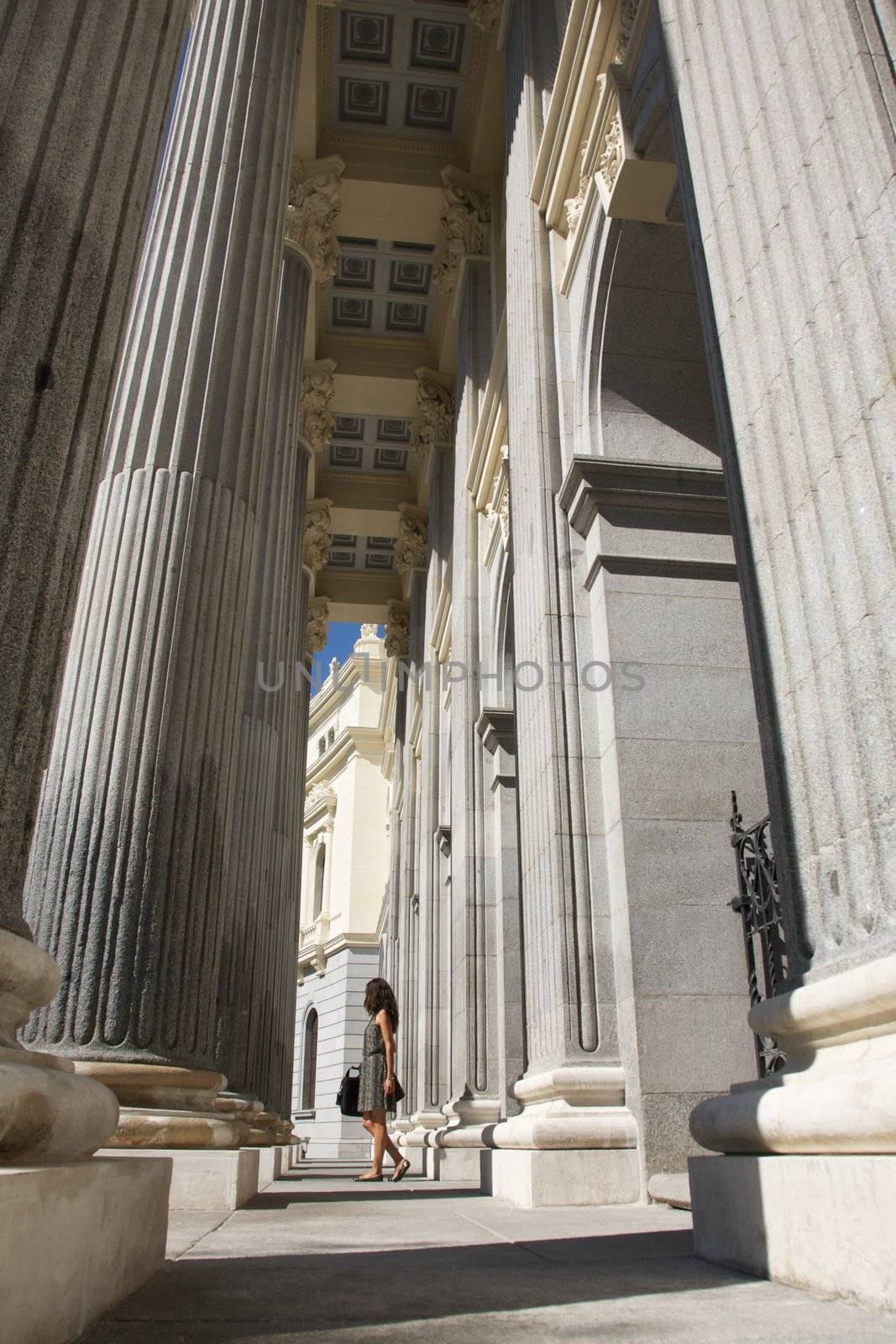 summer businesswoman between columns by quintanilla