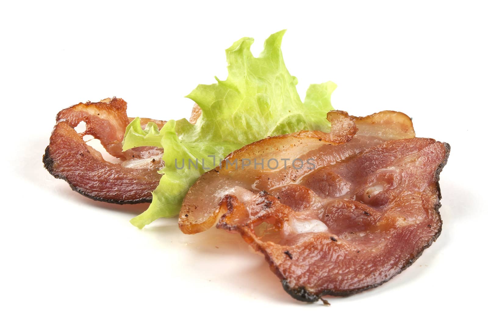 Two pieces of bacon with fresh lettuce