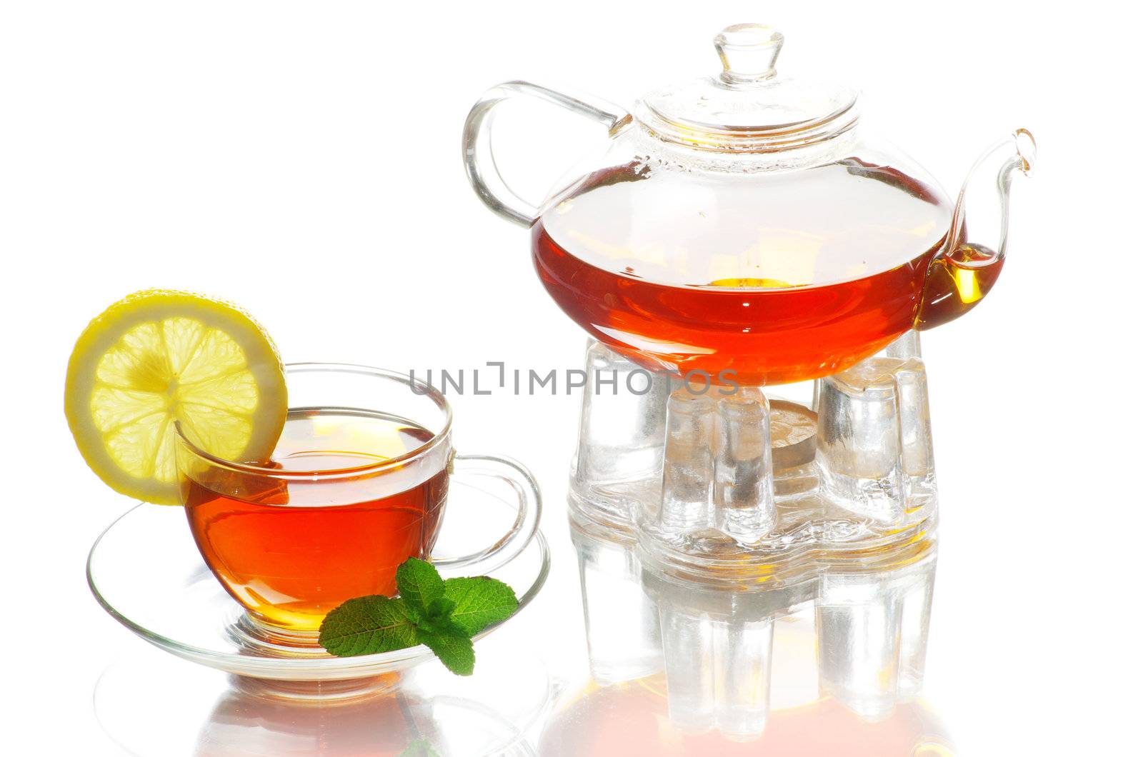 Tea being poured into glass tea cup