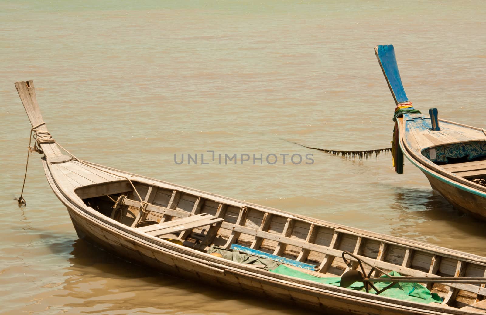 Local fishing boats. Moored in the harbor where the water is not deep.