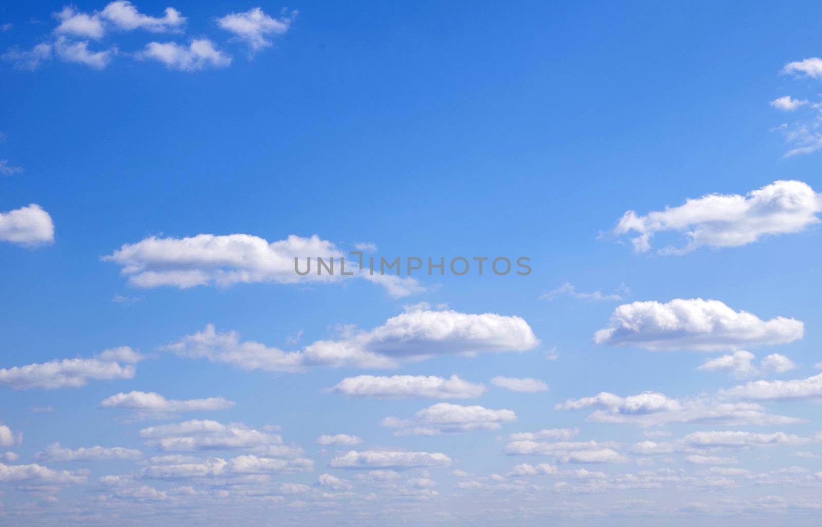 blue sky background with tiny clouds
