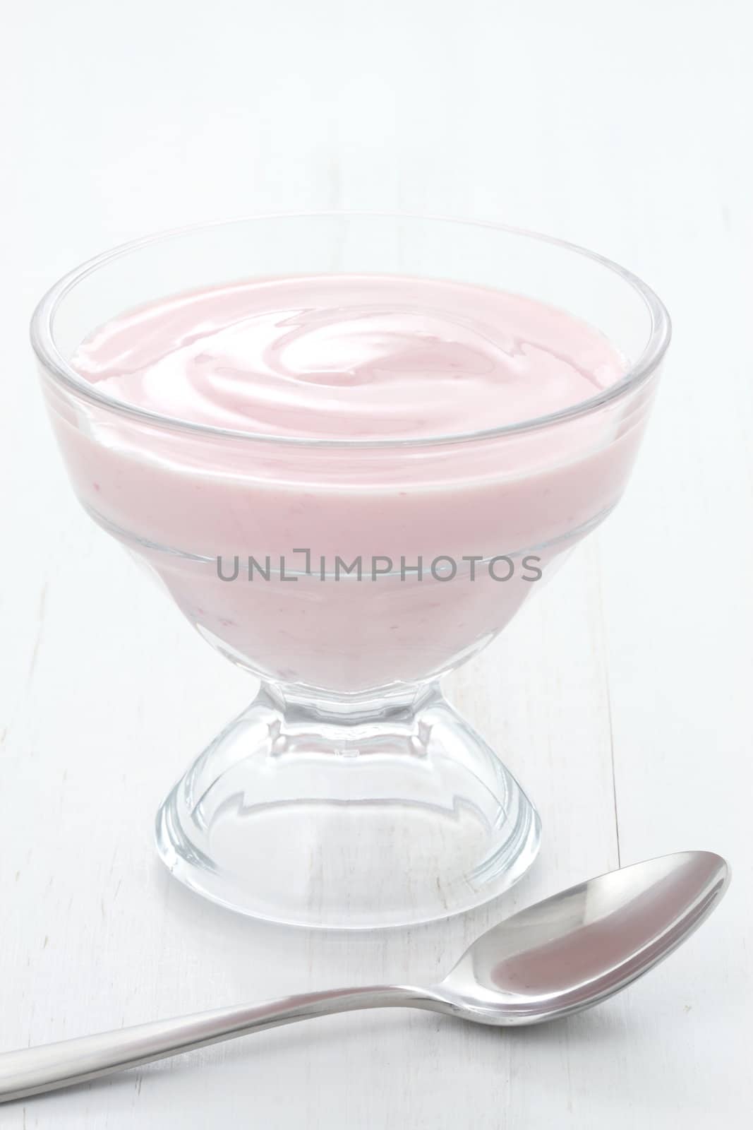 Fresh, healthy and delicious creamy, strawberry yogurt in vintage French cup, the perfect snack or dessert.