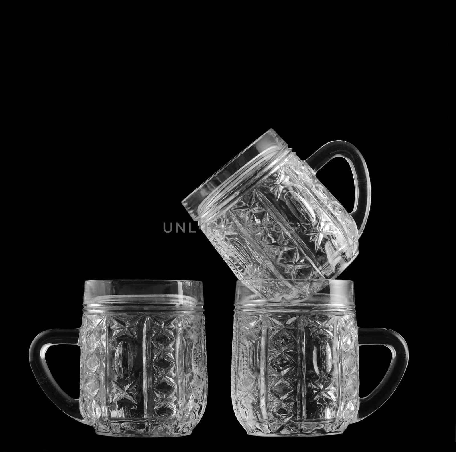 three crystal glass isolated on a black background