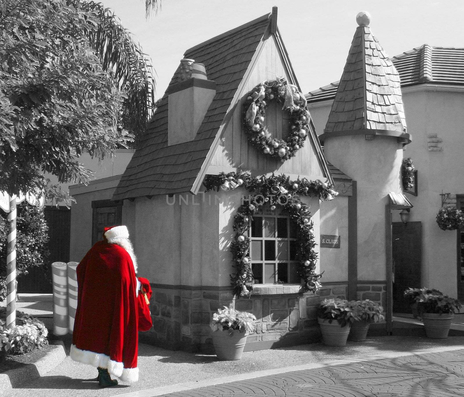 Santa walking to his workshop selective color.