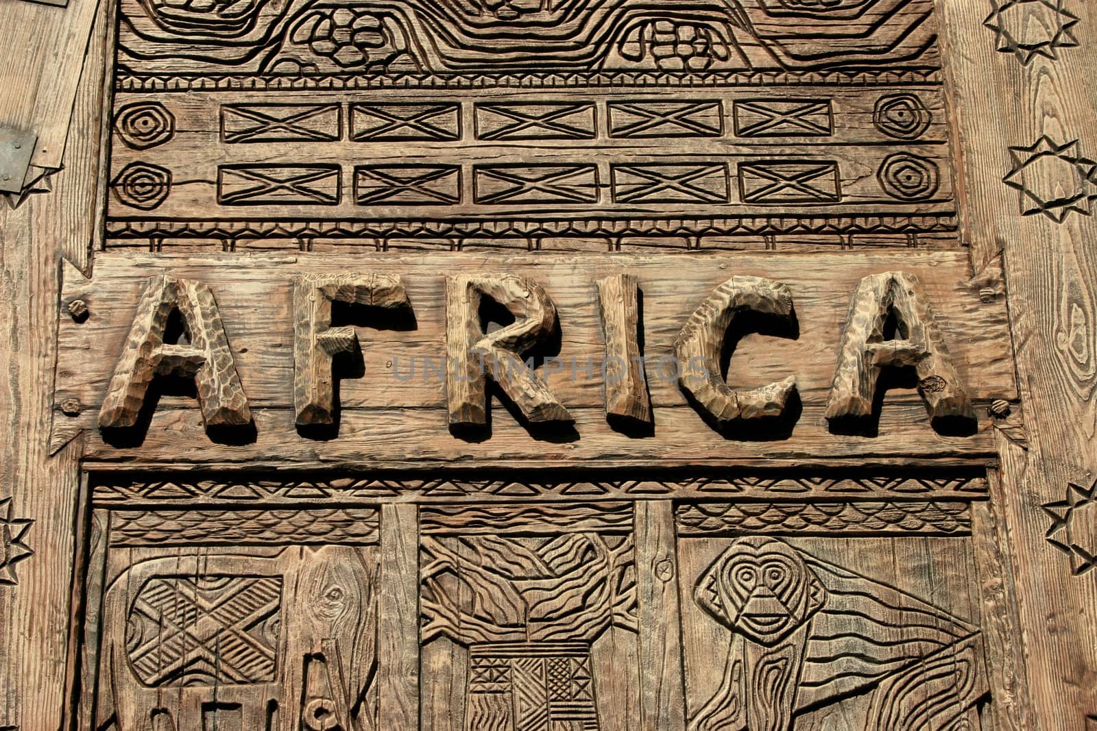 An africa sign on wood with carvings.