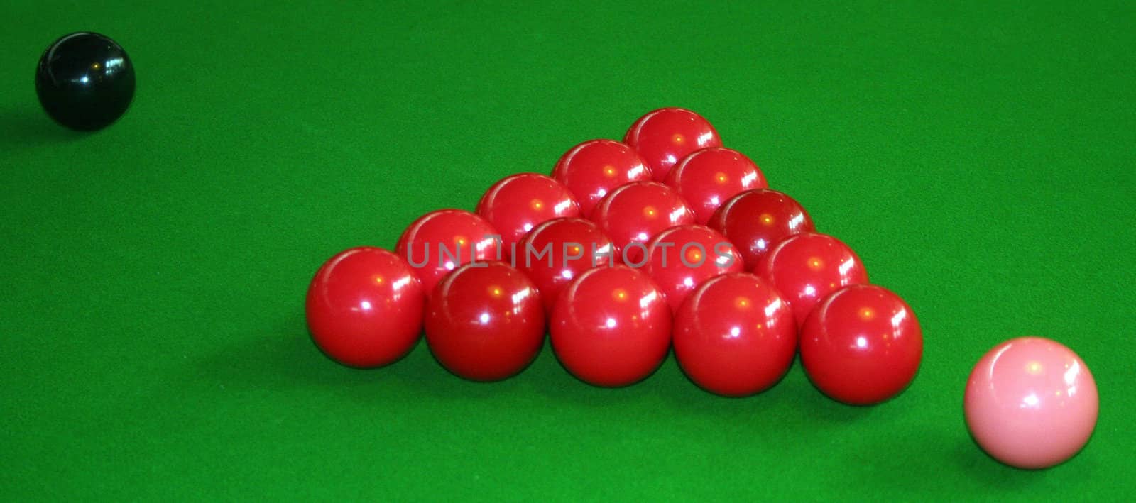 Snooker table with the red balls pink and black ball.