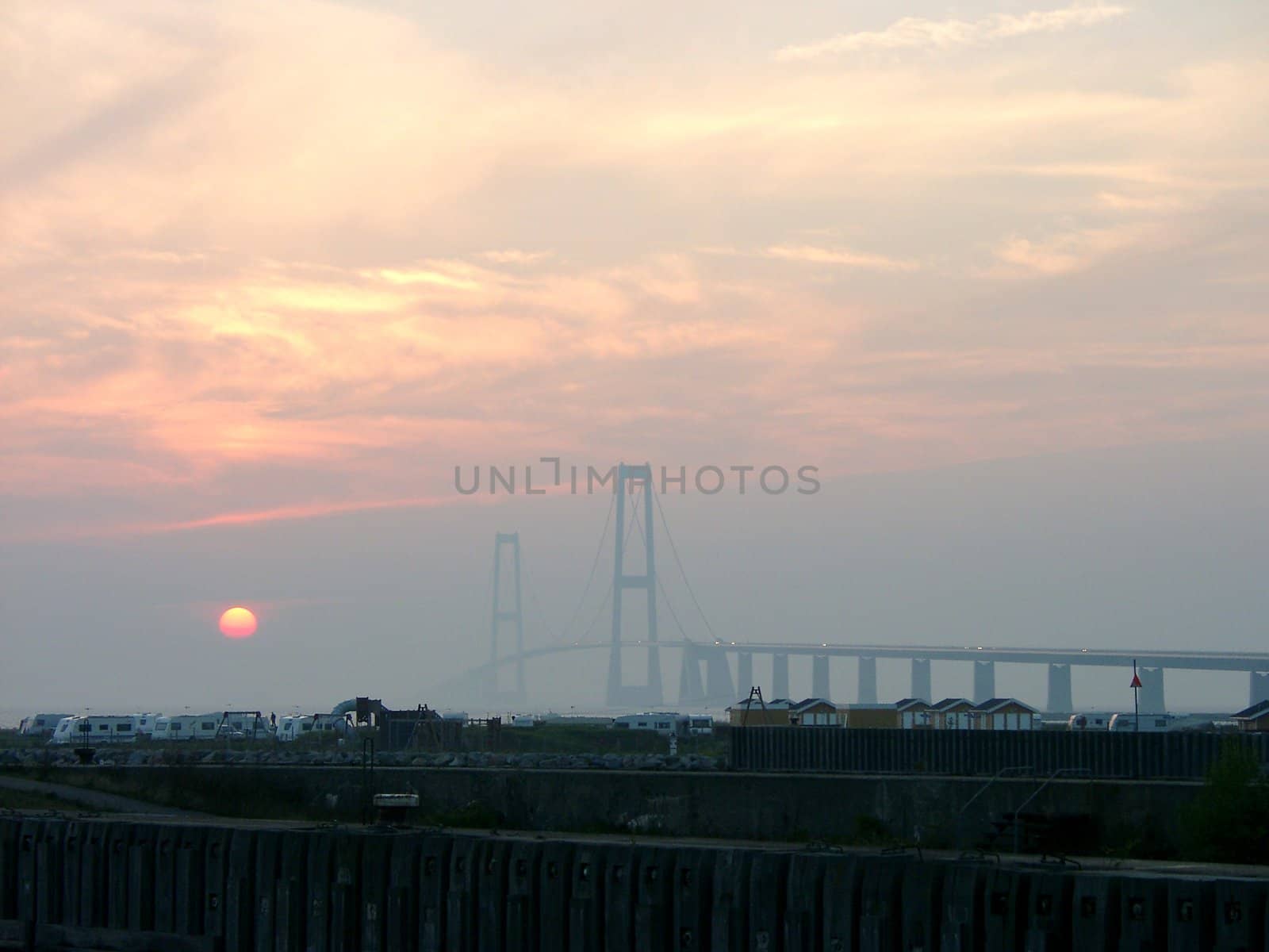 View of sunset over the camping near Storebelt Bridge in Denmark