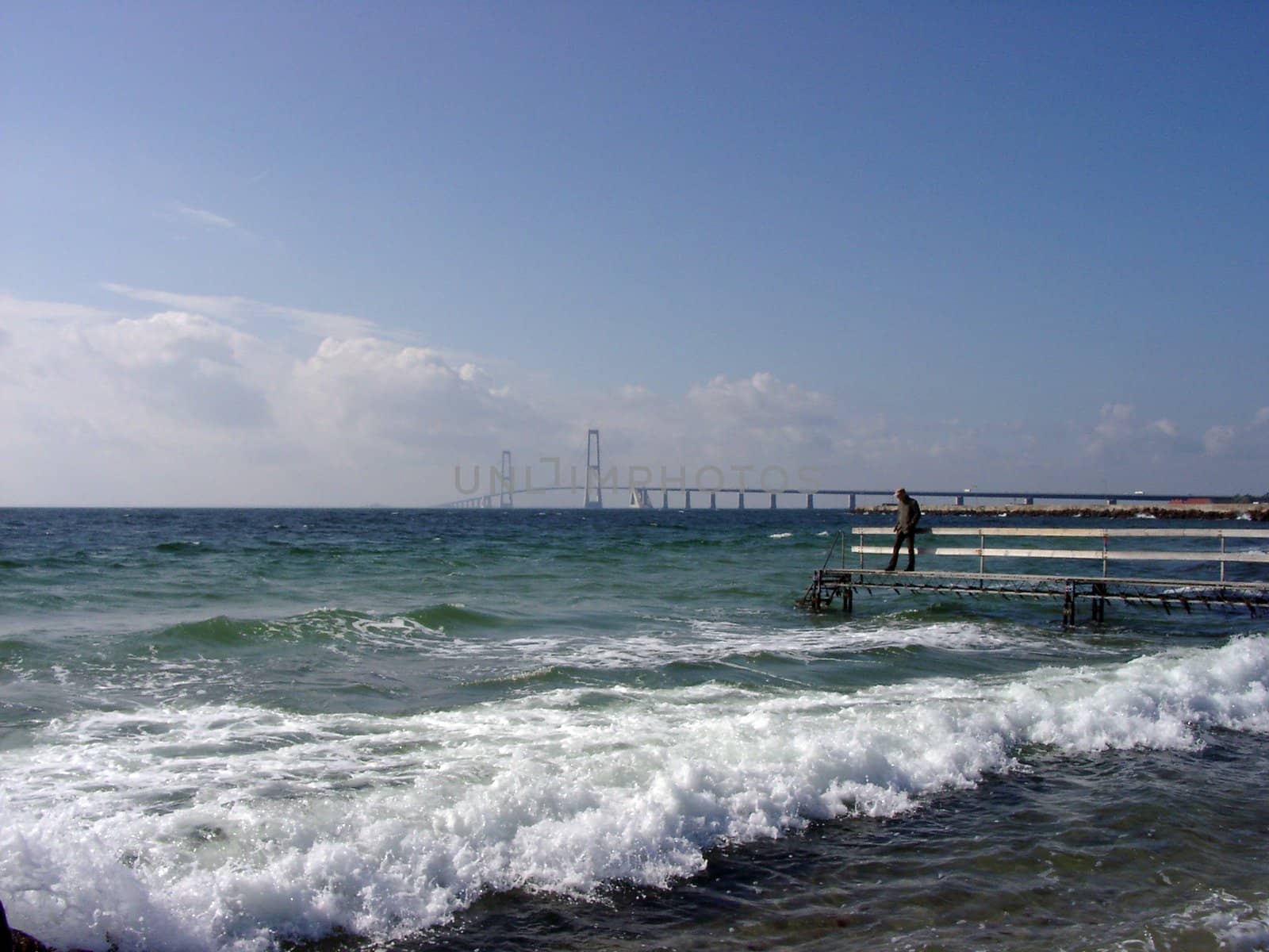 View of the giant bridge between Zealand Isl. and Fyn Isl., Denmark, at sunny day.