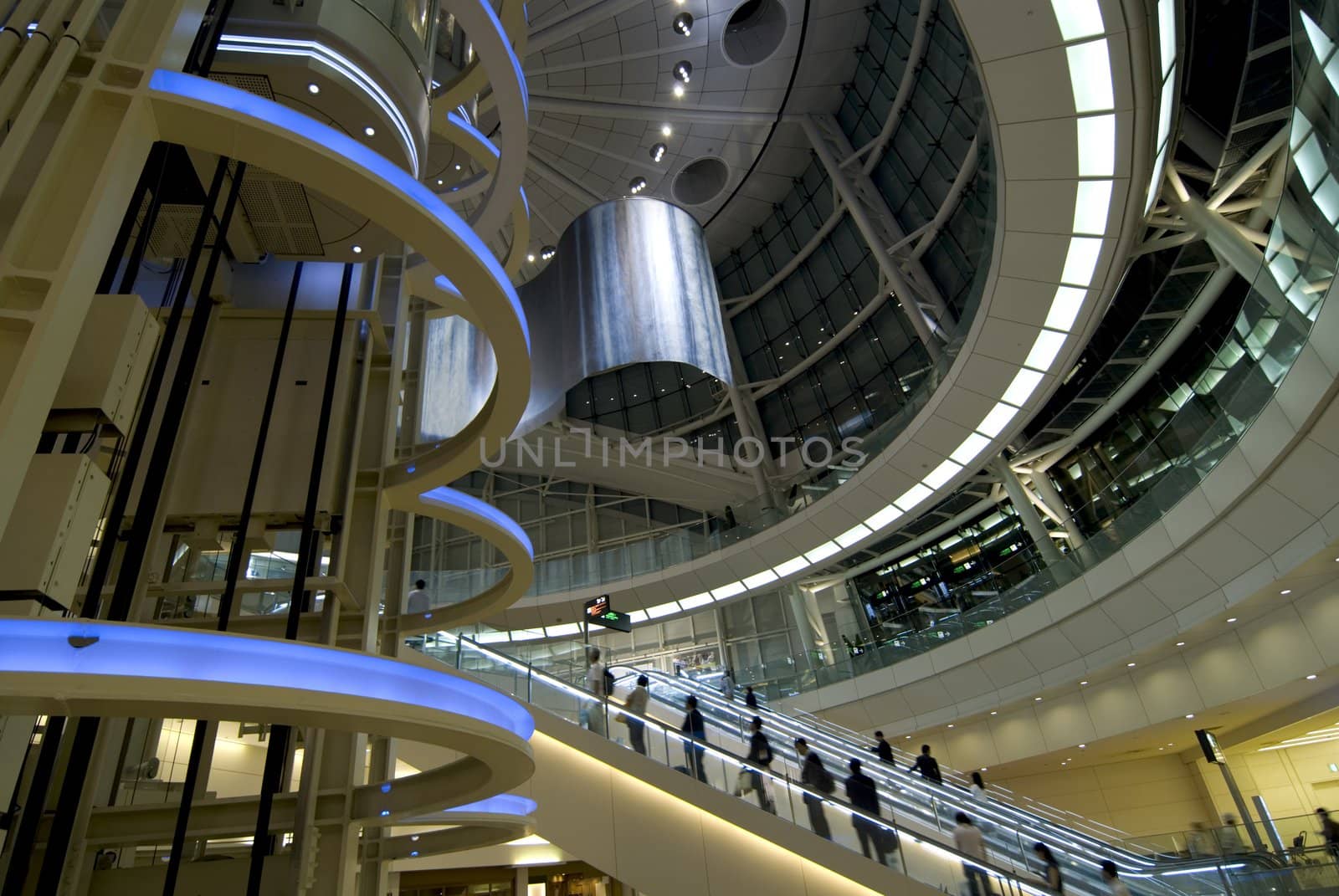 futuristic interior with moving escalator and many people on it, Tokyo Japan