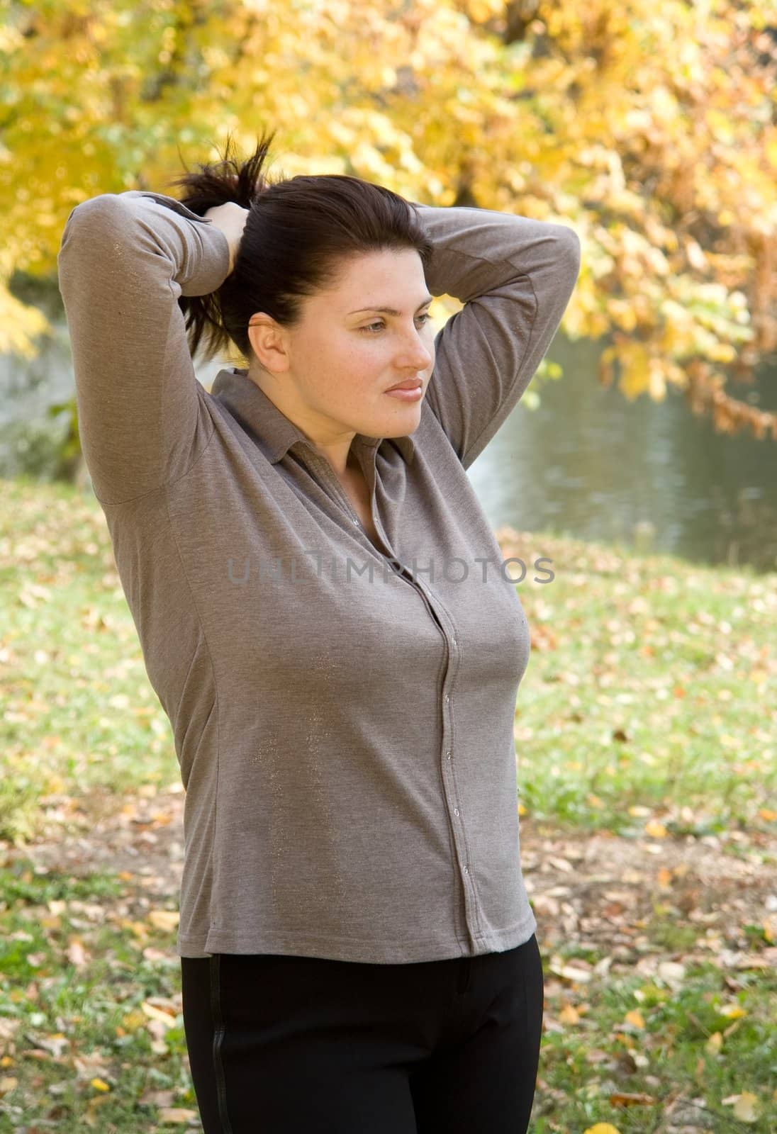 Autumn. Beautiful young woman against autumn park.