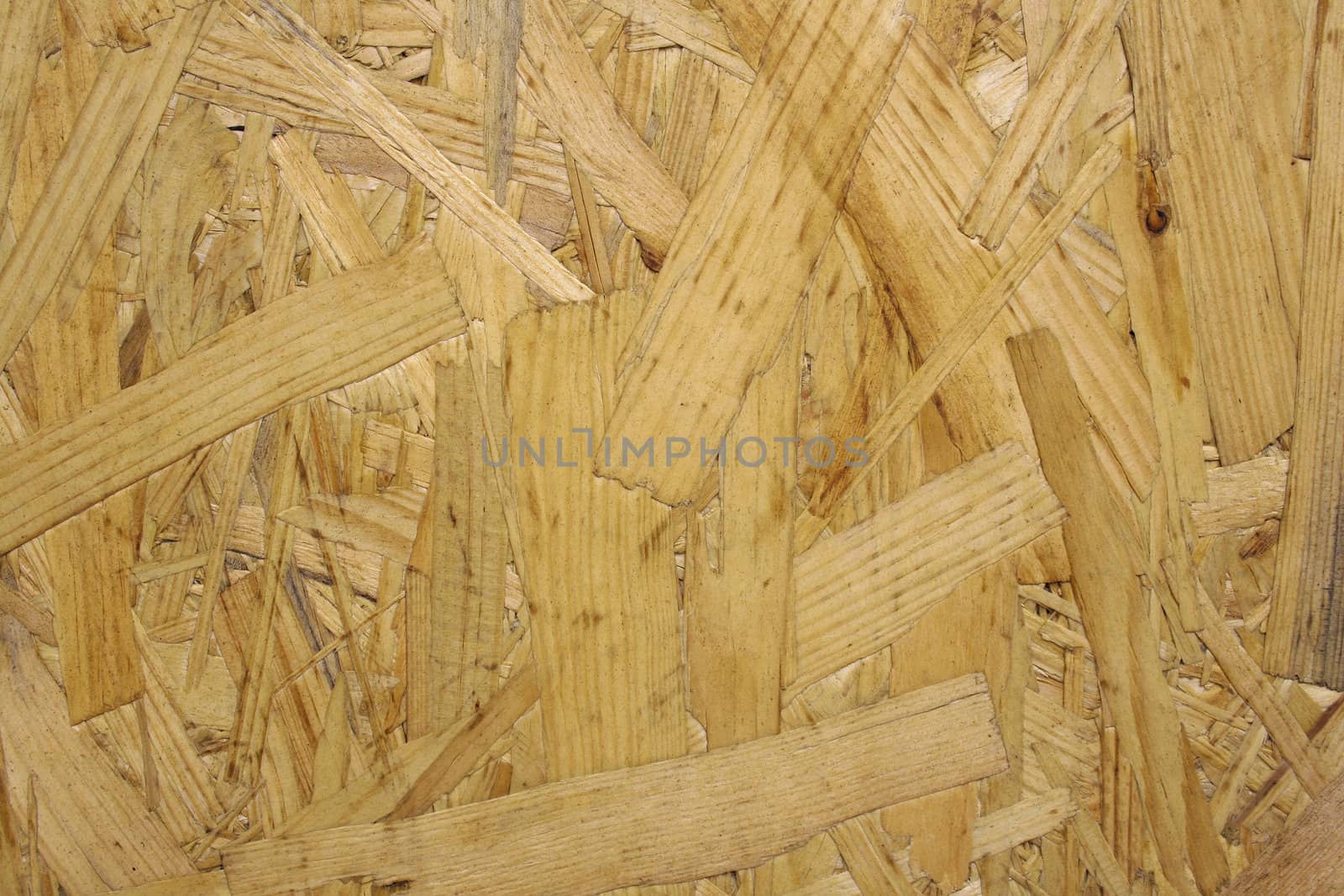 Board of compressed wood at a construction site. Background texture.