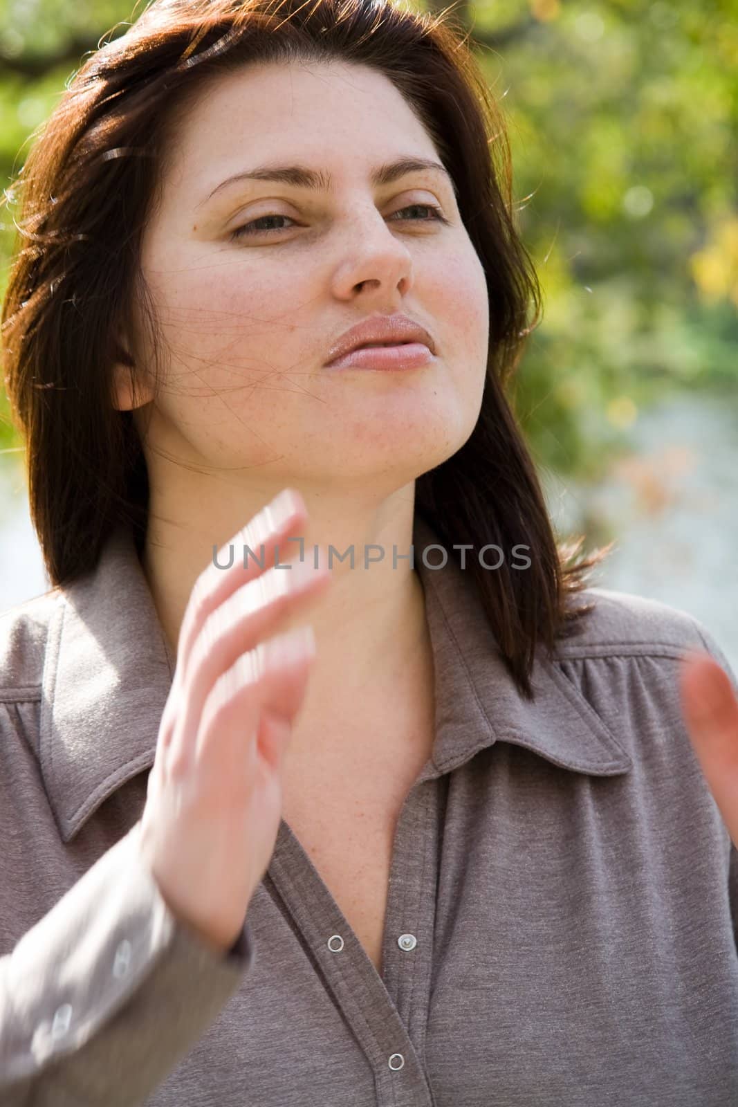 Autumn. Beautiful young woman against autumn park.