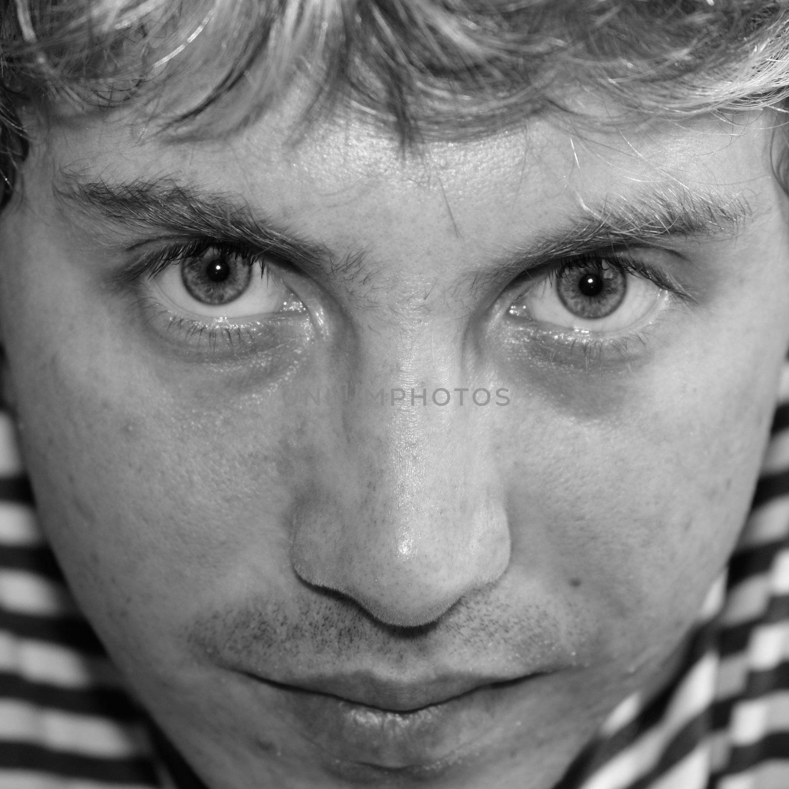 Sad young man close up. Black � and - white portrait.