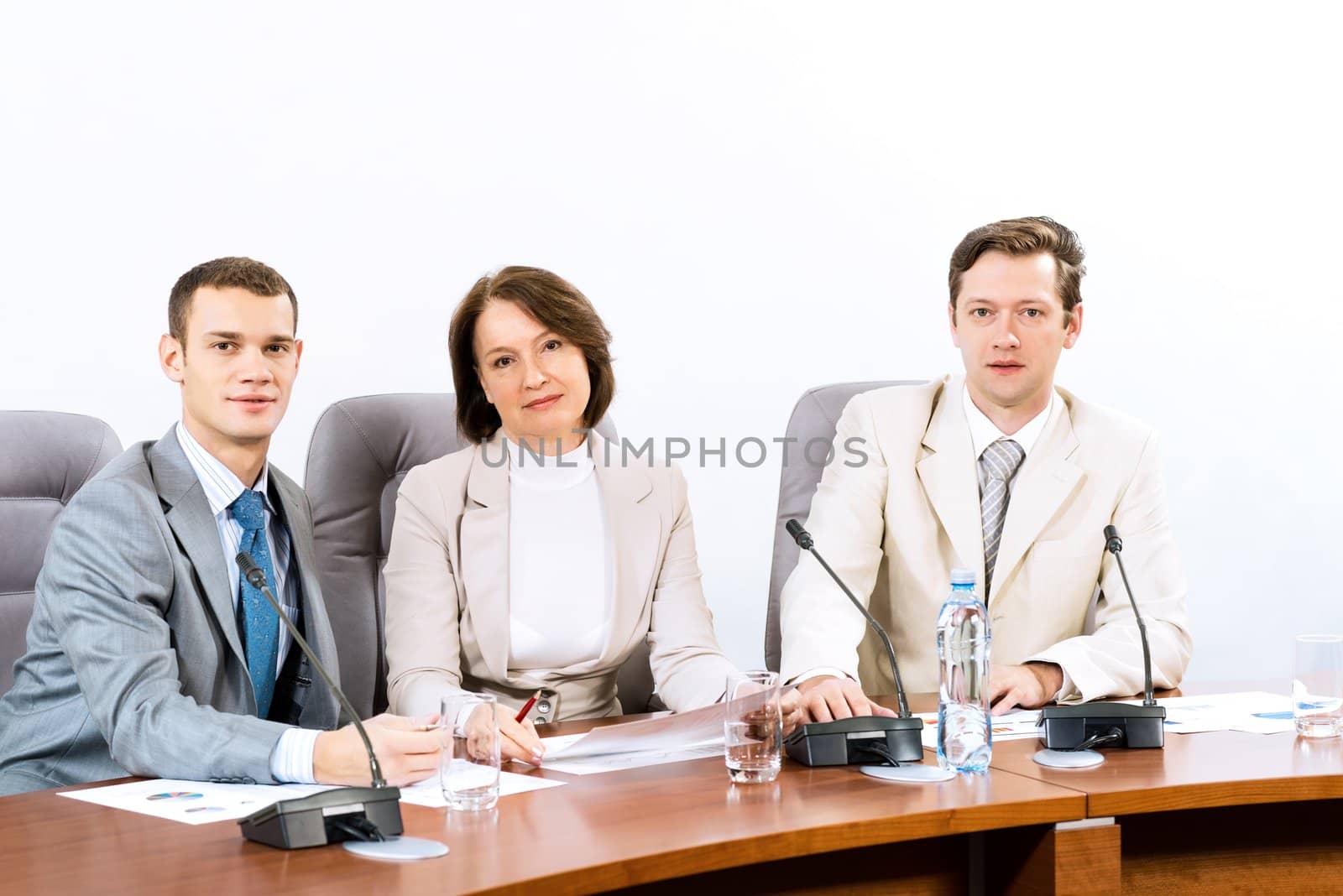 businessmen sitting in a chair at the table, communicate at the conference