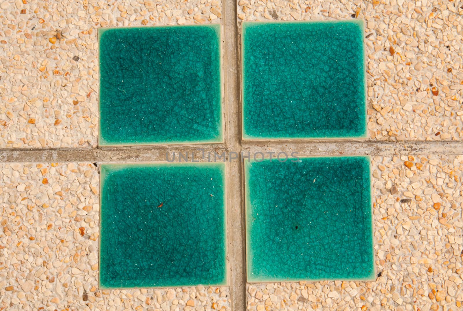 Tiles in the tile surface facing the green.
