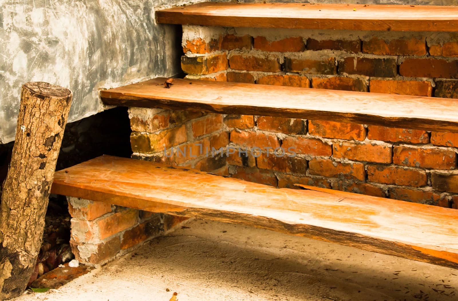 The stairs are decorated in natural wood.