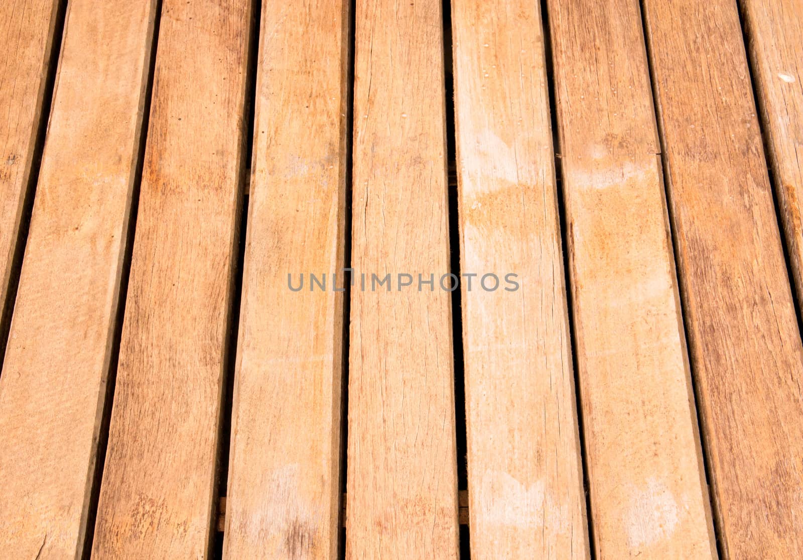 Wood stacked in rows. For use as a background.