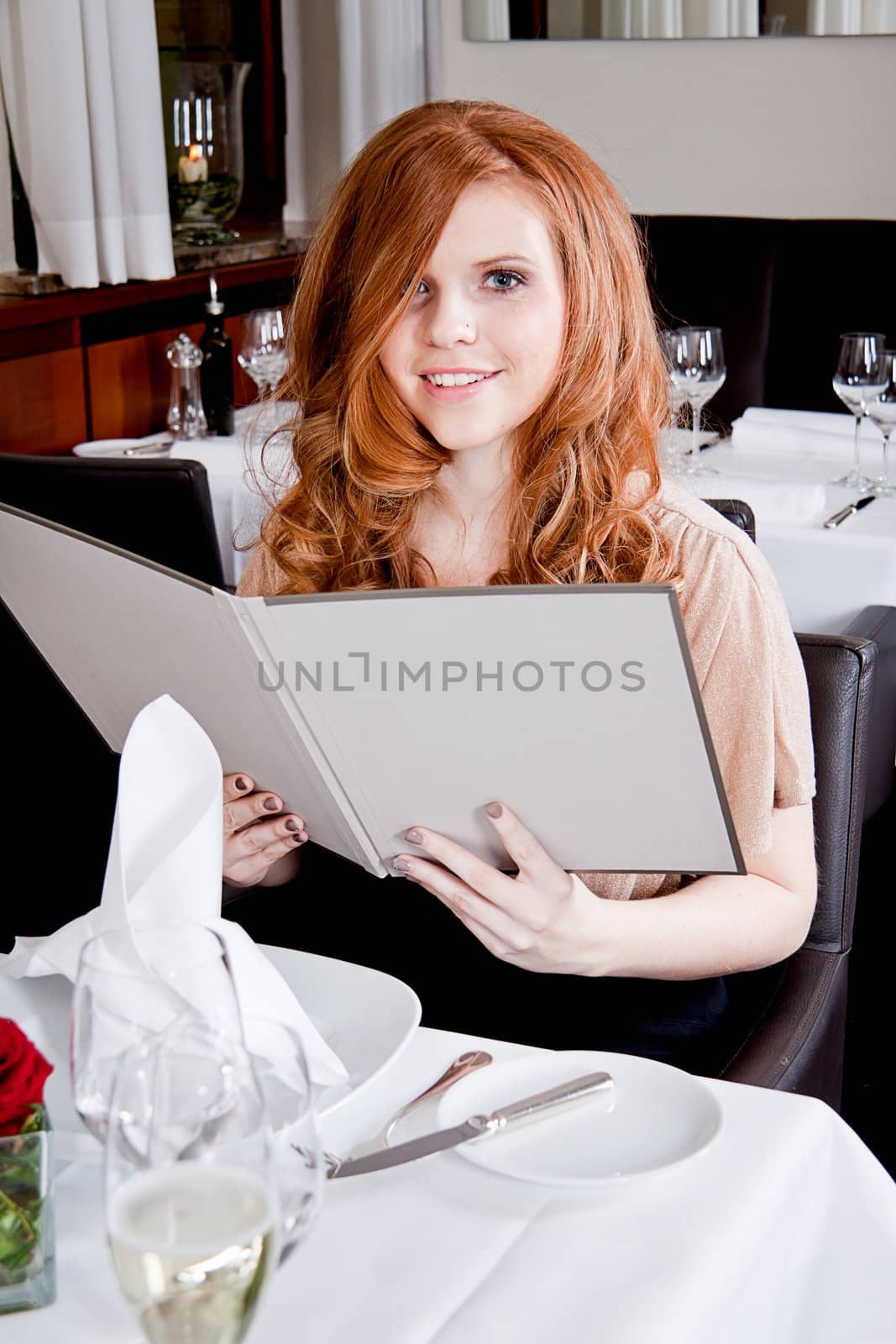 man and woman in restaurant waiter bring card and order food