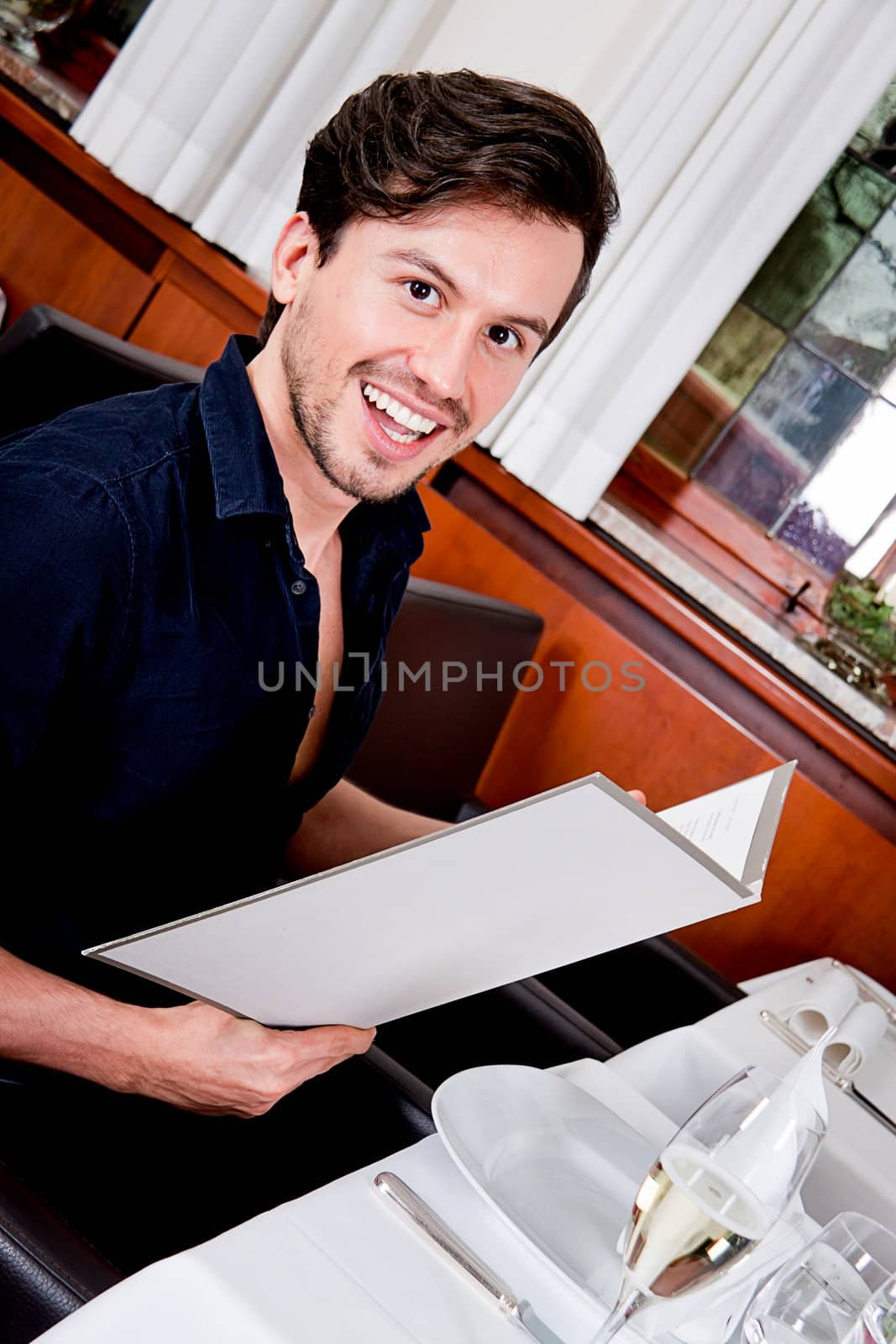 man and woman in restaurant waiter bring card and order food