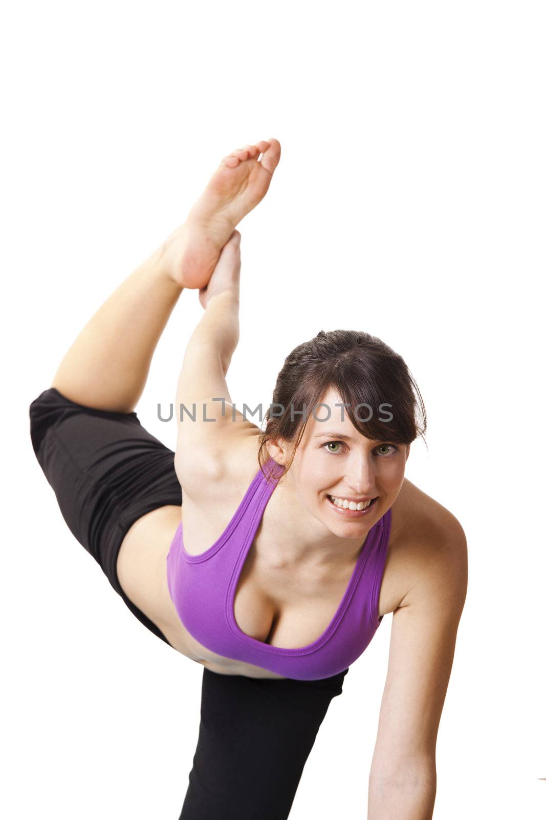 Beautiful and athletic young woman doing yoga exercises