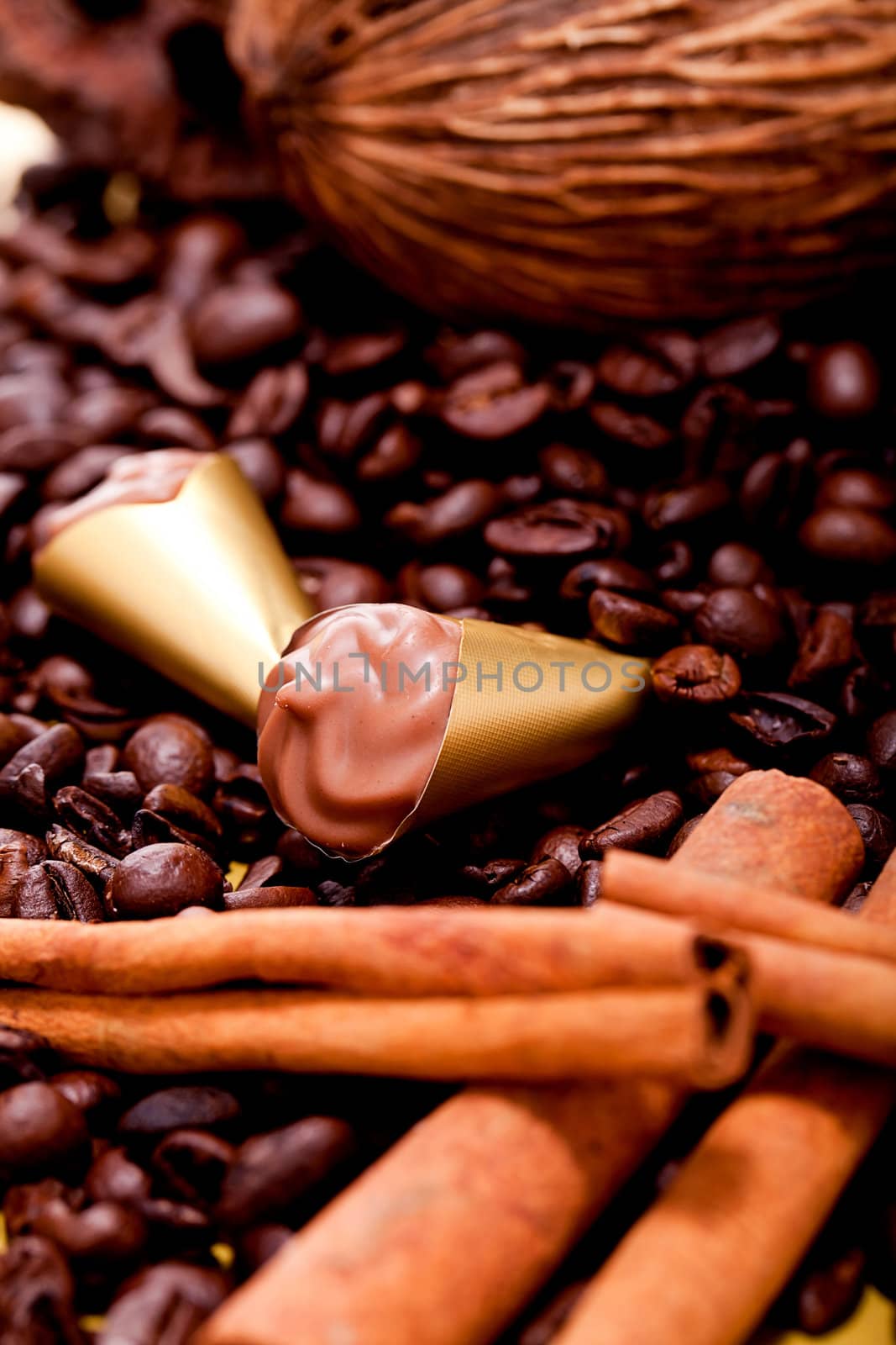 collection of different chocolate pralines truffels on golden brown background macro