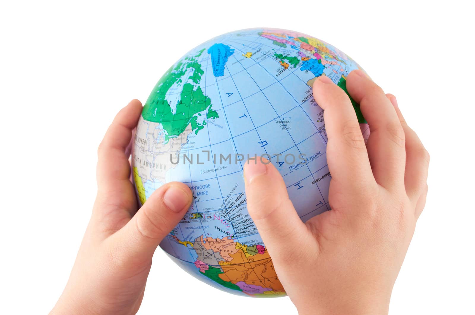Globe in children's hands on an isolated white background