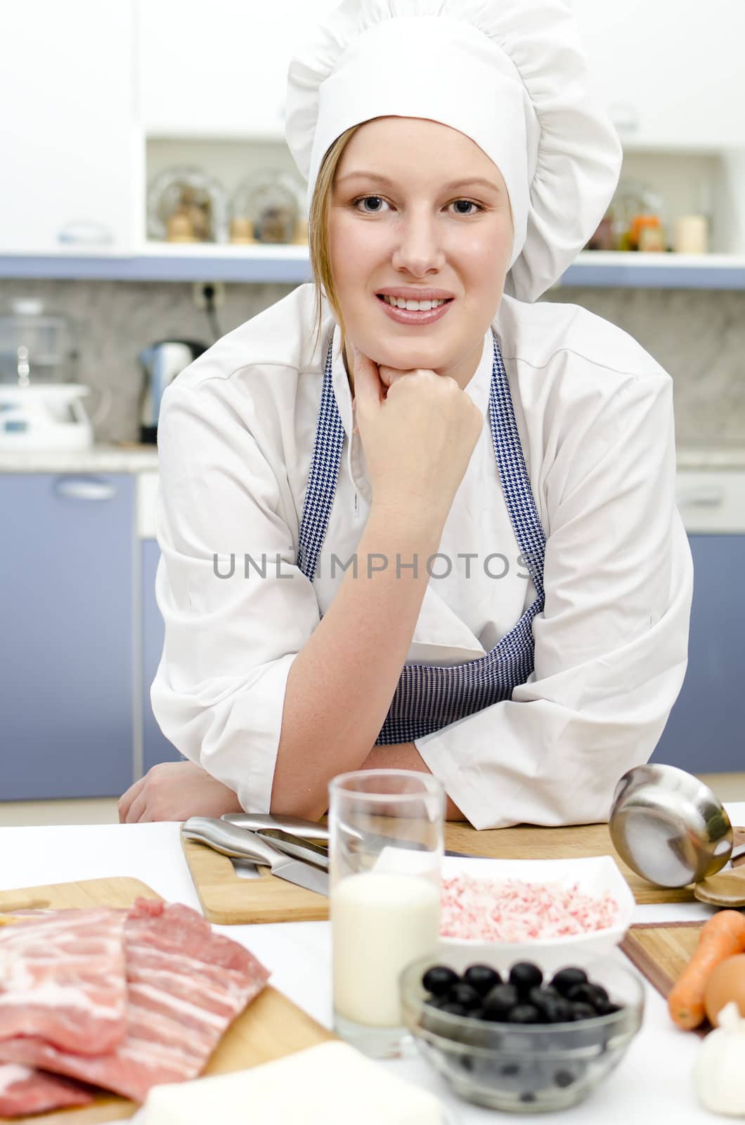 Smiling chief cook in the kitchen