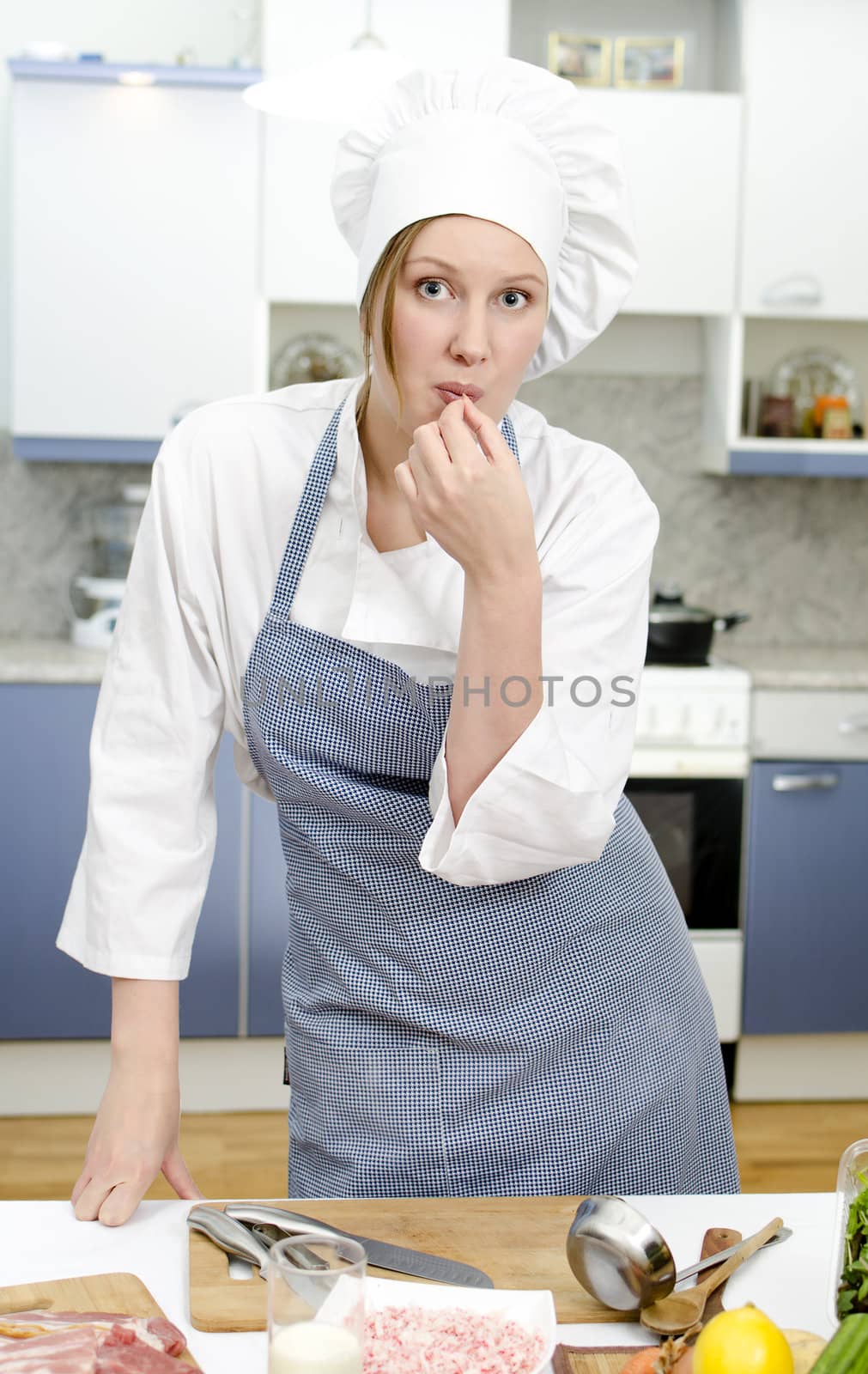 Smiling chief cook in the kitchen