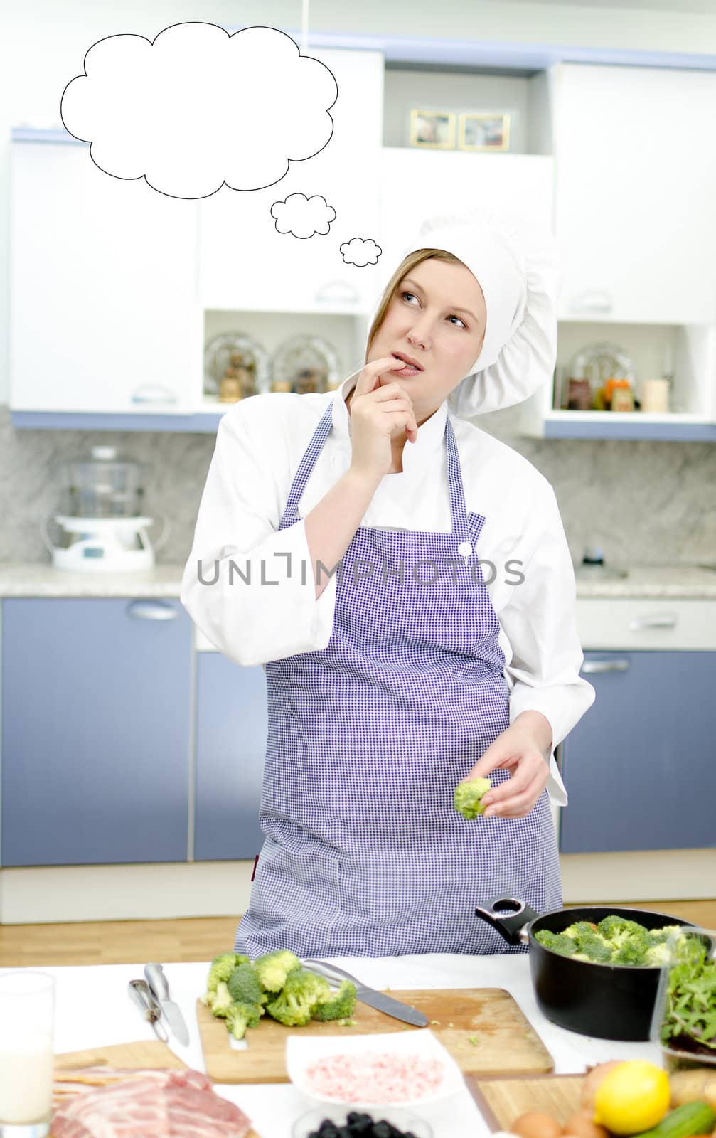 Attractive chief cook thinking, place for text