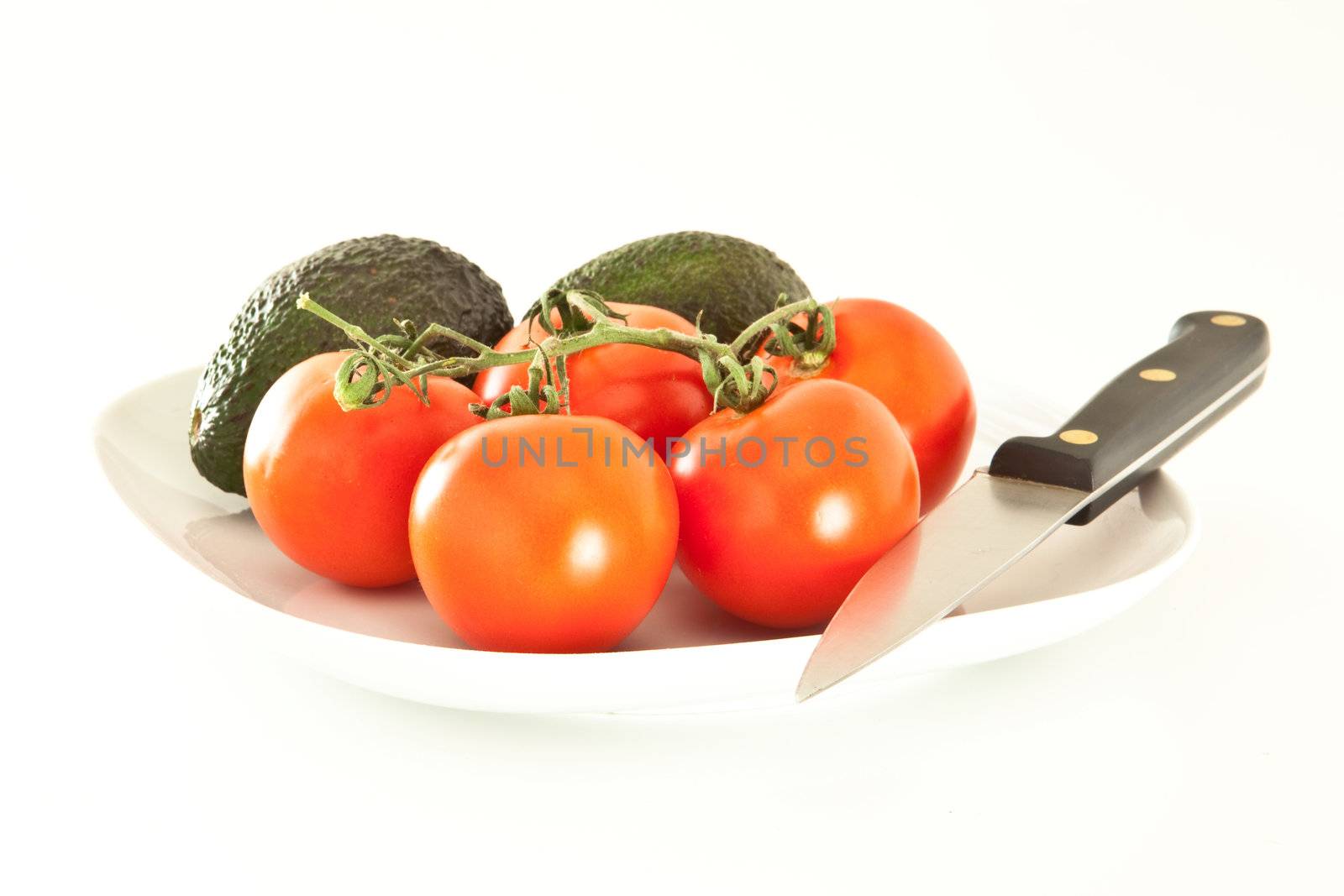 Fresh tomatoes and avocados