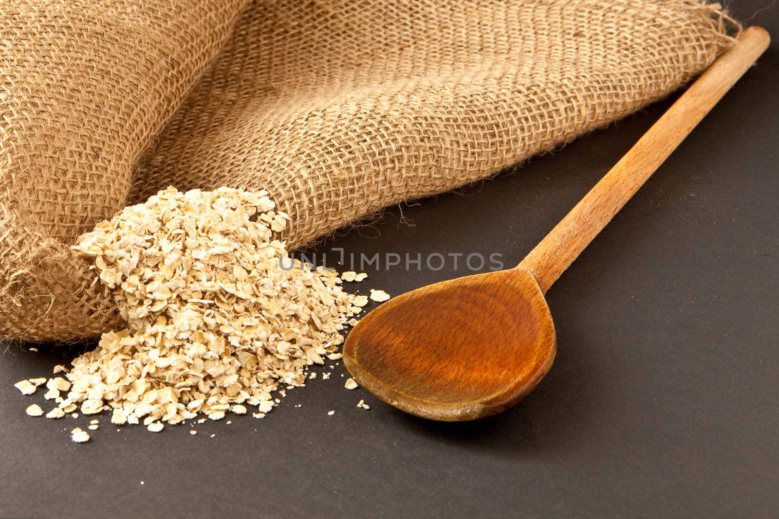 porridge oats and wooden spoon