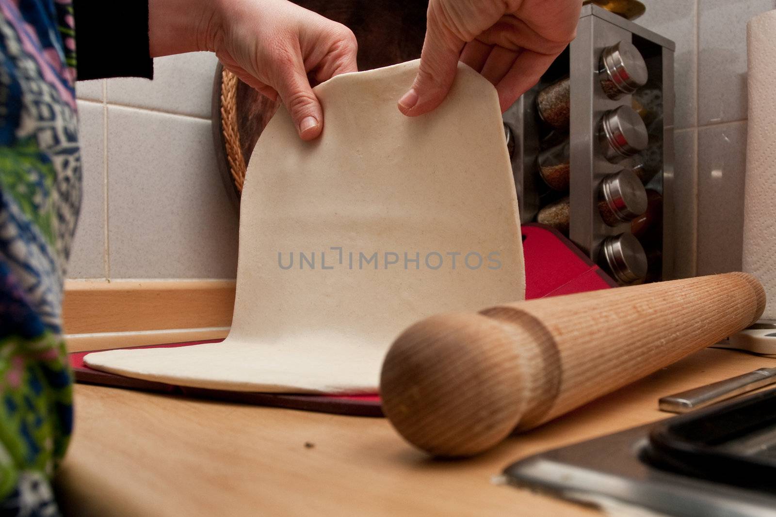 hands rolling pastry