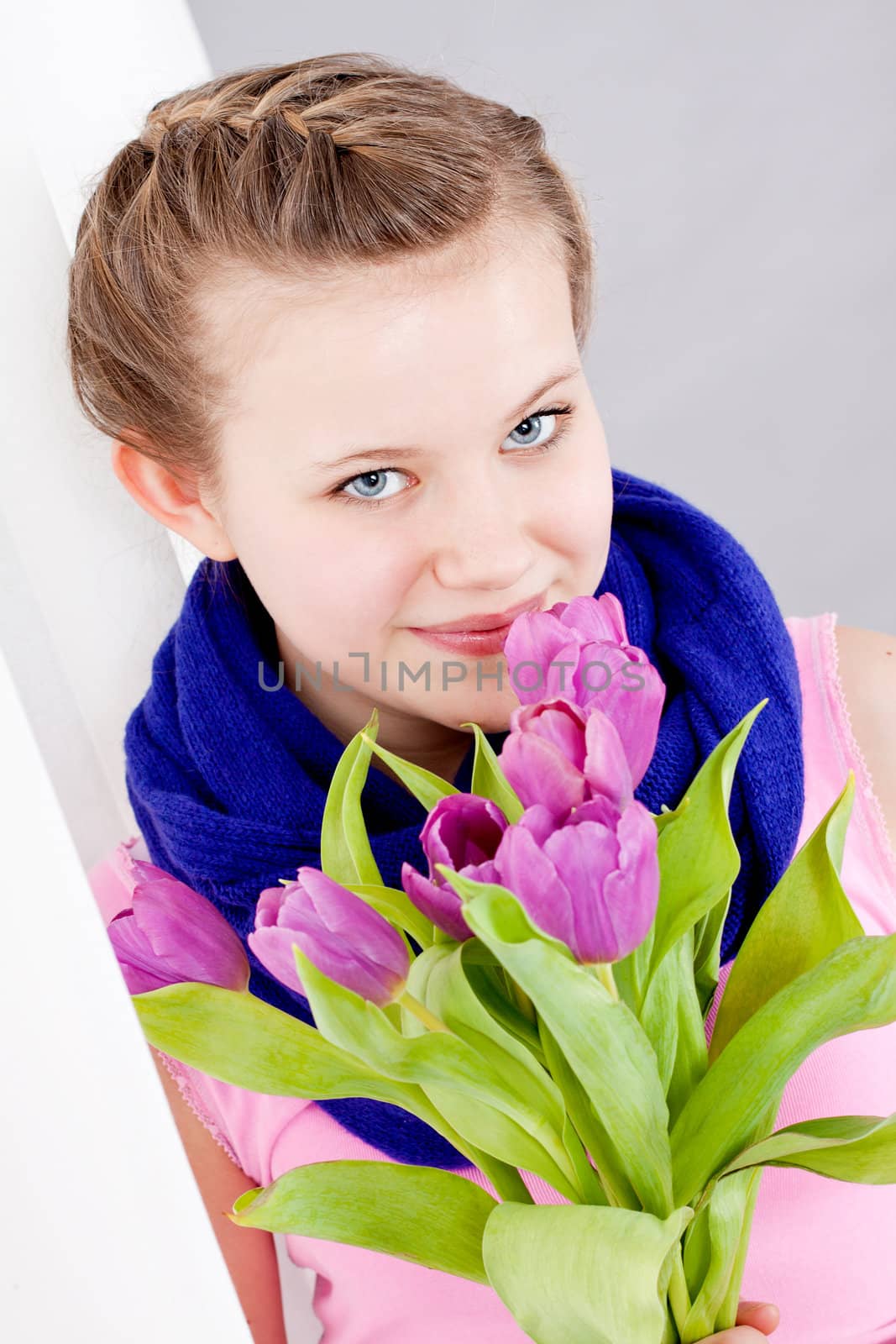 smiling teenager girl with pink tulips bouquet present gift easter mothersday valentine birthday