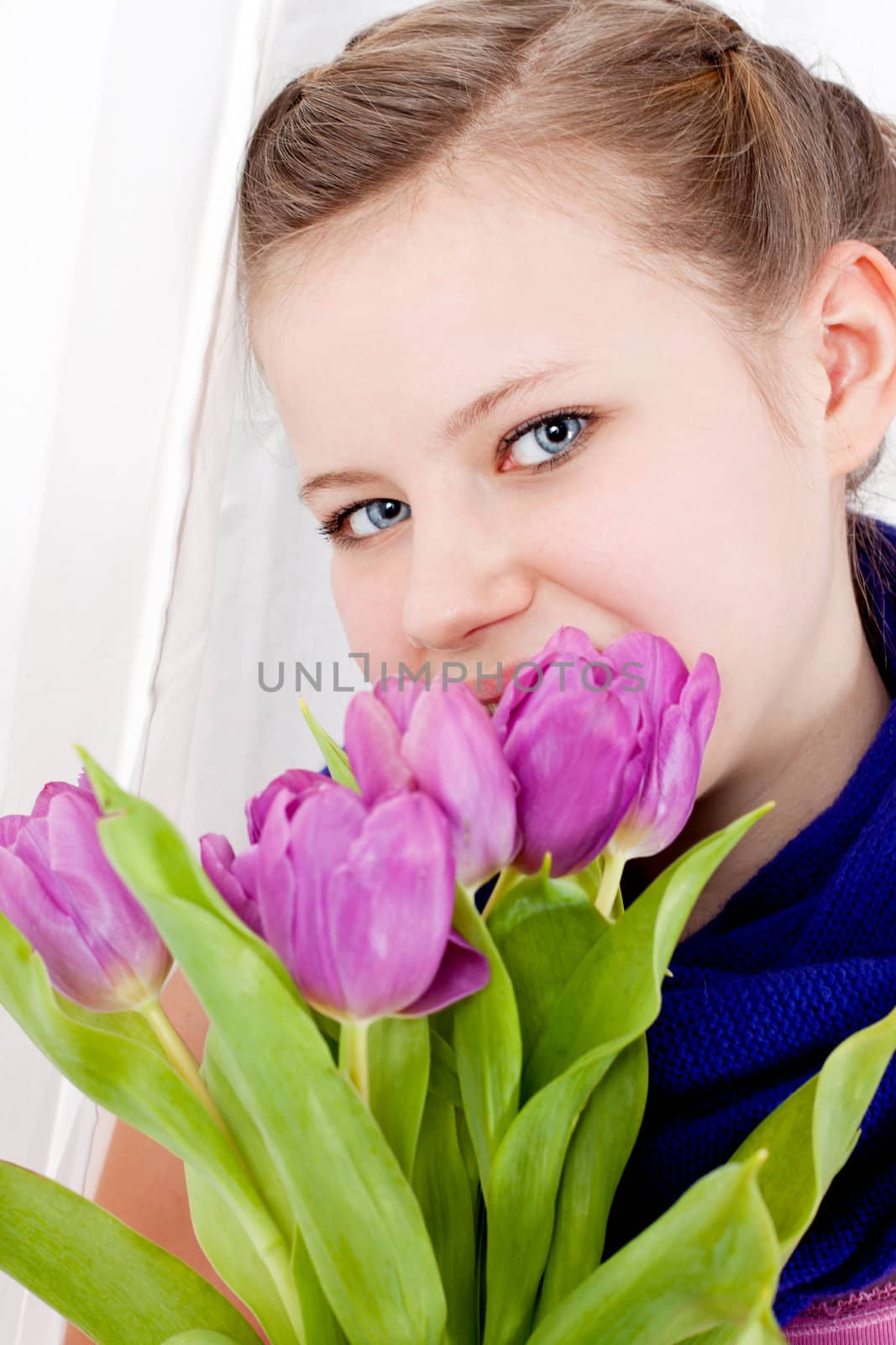 smiling teenager girl with pink tulips bouquet present gift easter mothersday valentine birthday
