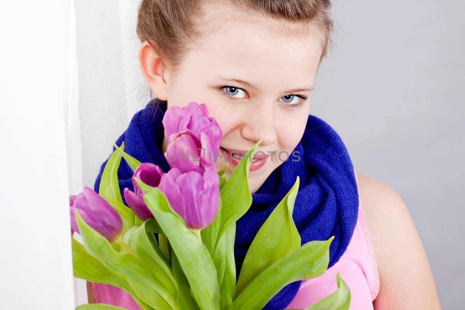 smiling teenager girl with pink tulips bouquet present gift easter mothersday valentine birthday