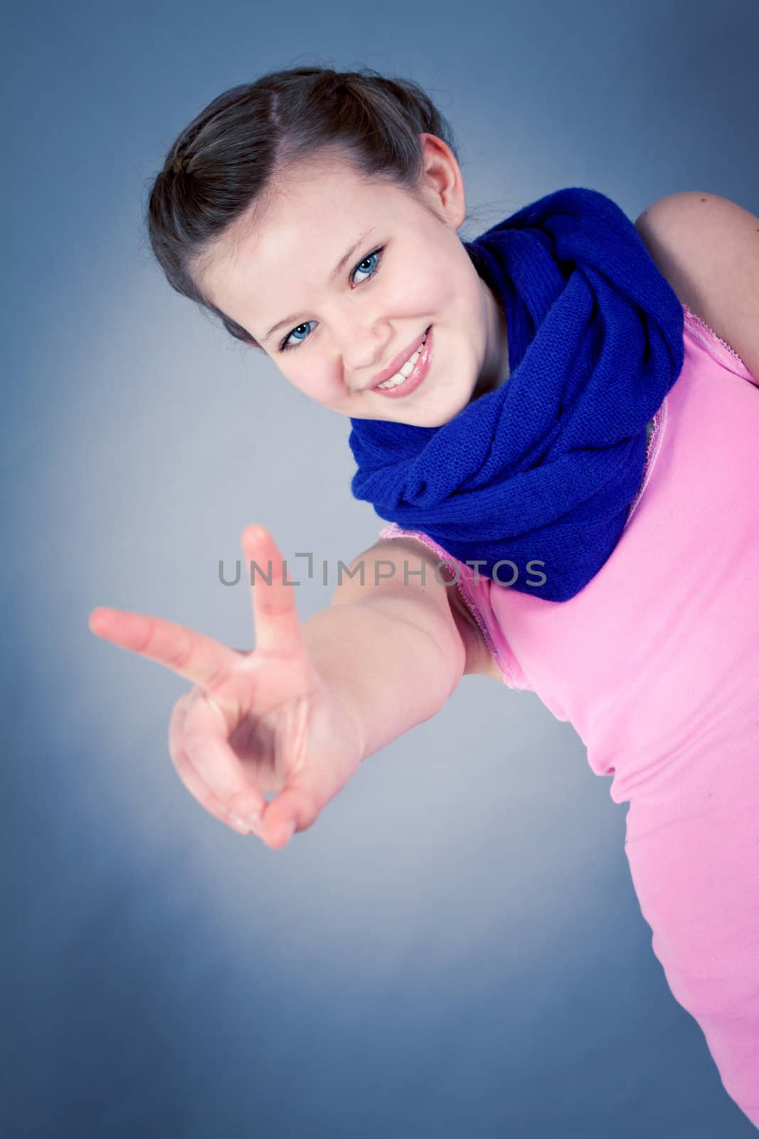 young teenager girl smiling having fun portrait blue scarf