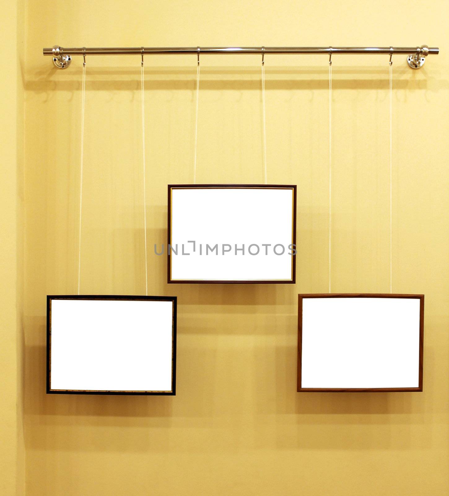 3 frames with isolated canvas on the exhibition ledge