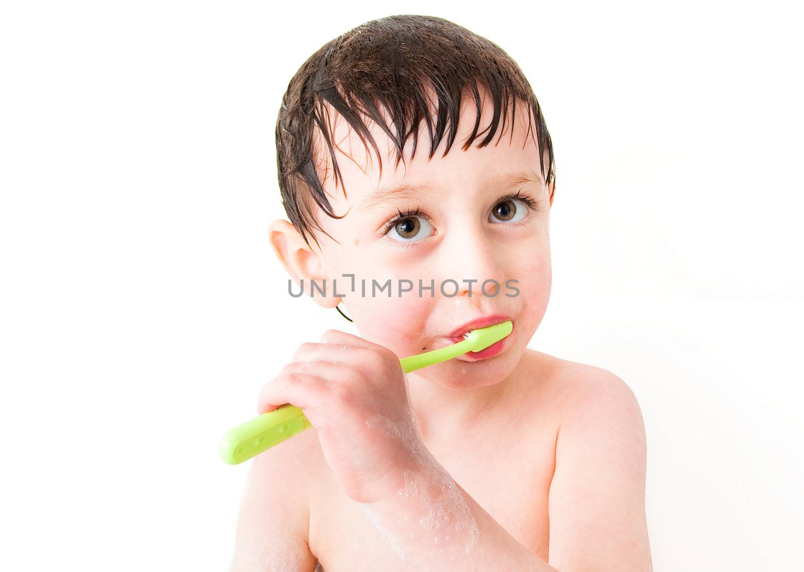 little boy claning teeth