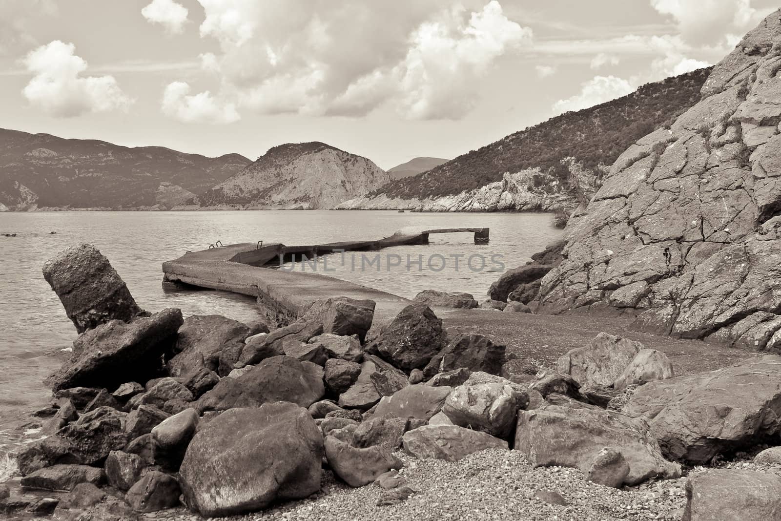 Old harbour on the Island of Alonissos with Skopelos in the background