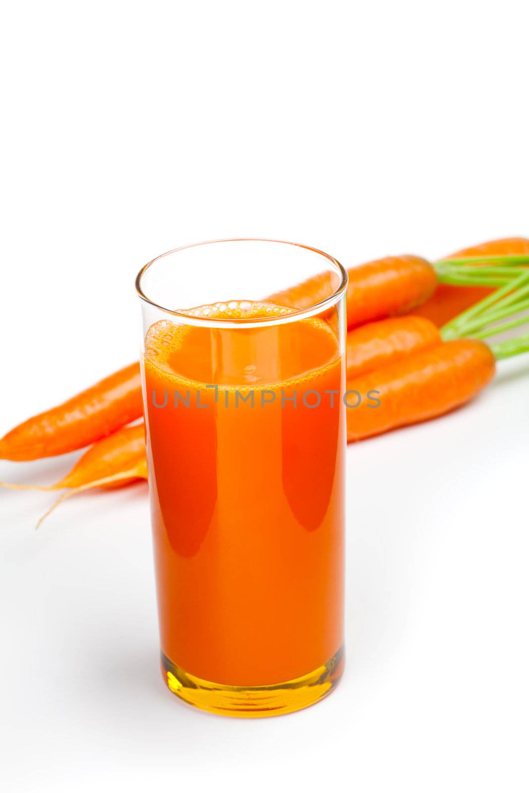 Carrot juice and fresh carrot, isolated on white background